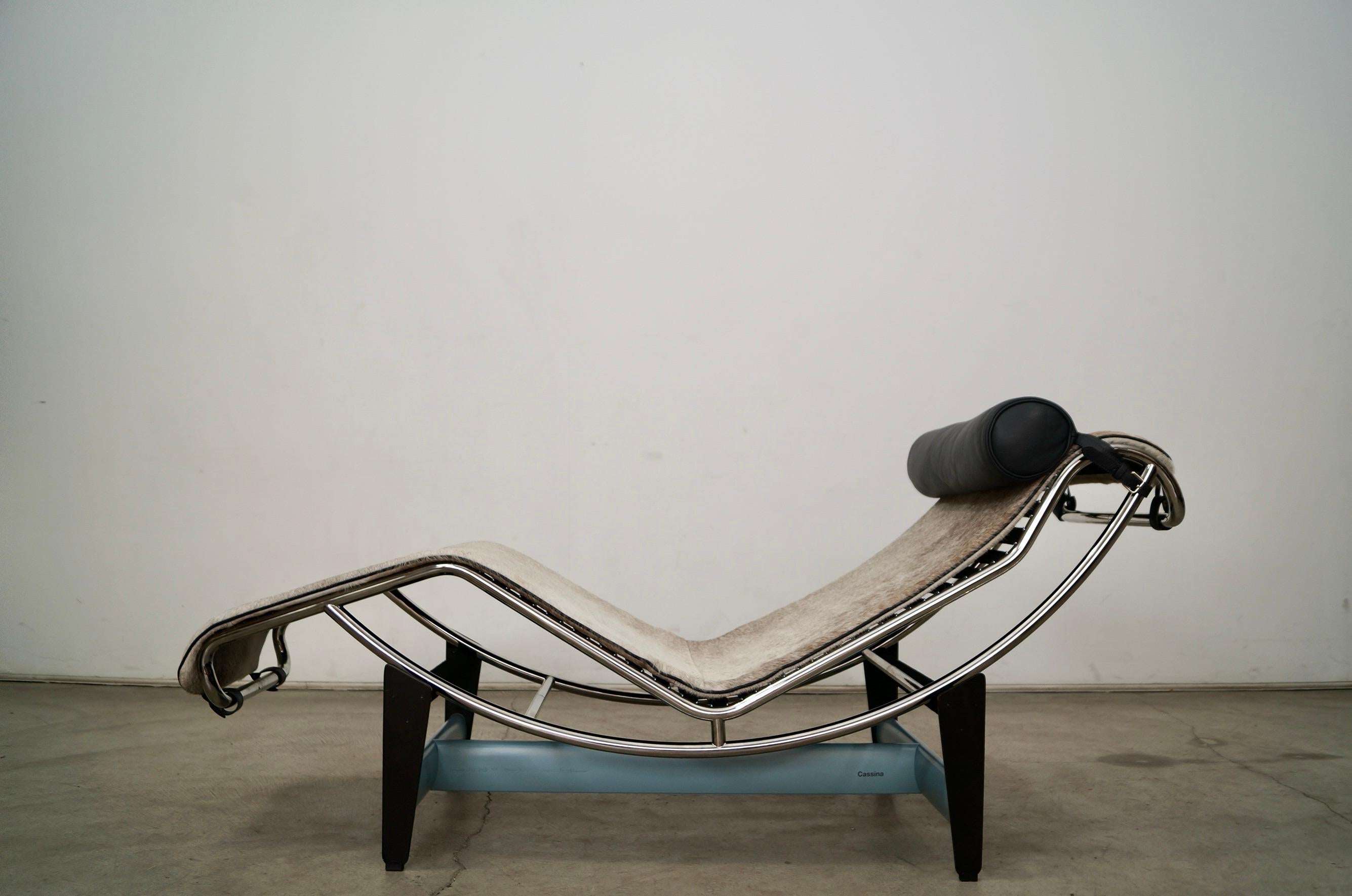 Original Cassina LC4 chaise lounge chair for sale. Designed by Corbusier in 1928, and is a Bauhaus design classic. This is a special edition with a light blue cross bar base and is signed in both the base and the chrome frame. It has a haired hide