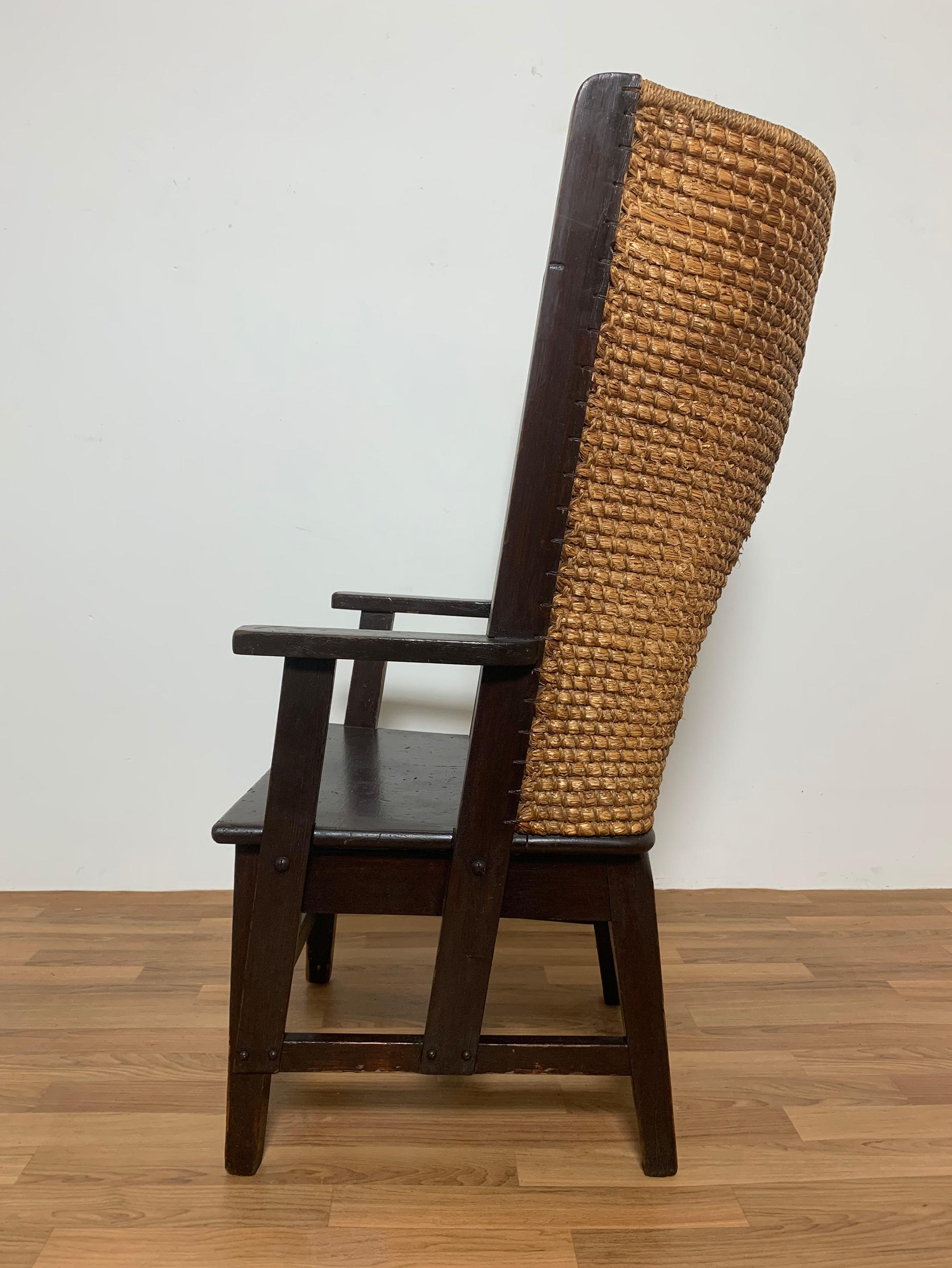 An original Scottish Orkney chair in pine and woven oat straw, made for Liberty of London, ca. late 1800s to early 1900s. Bears celluloid tag for Liberty to bottom rail.