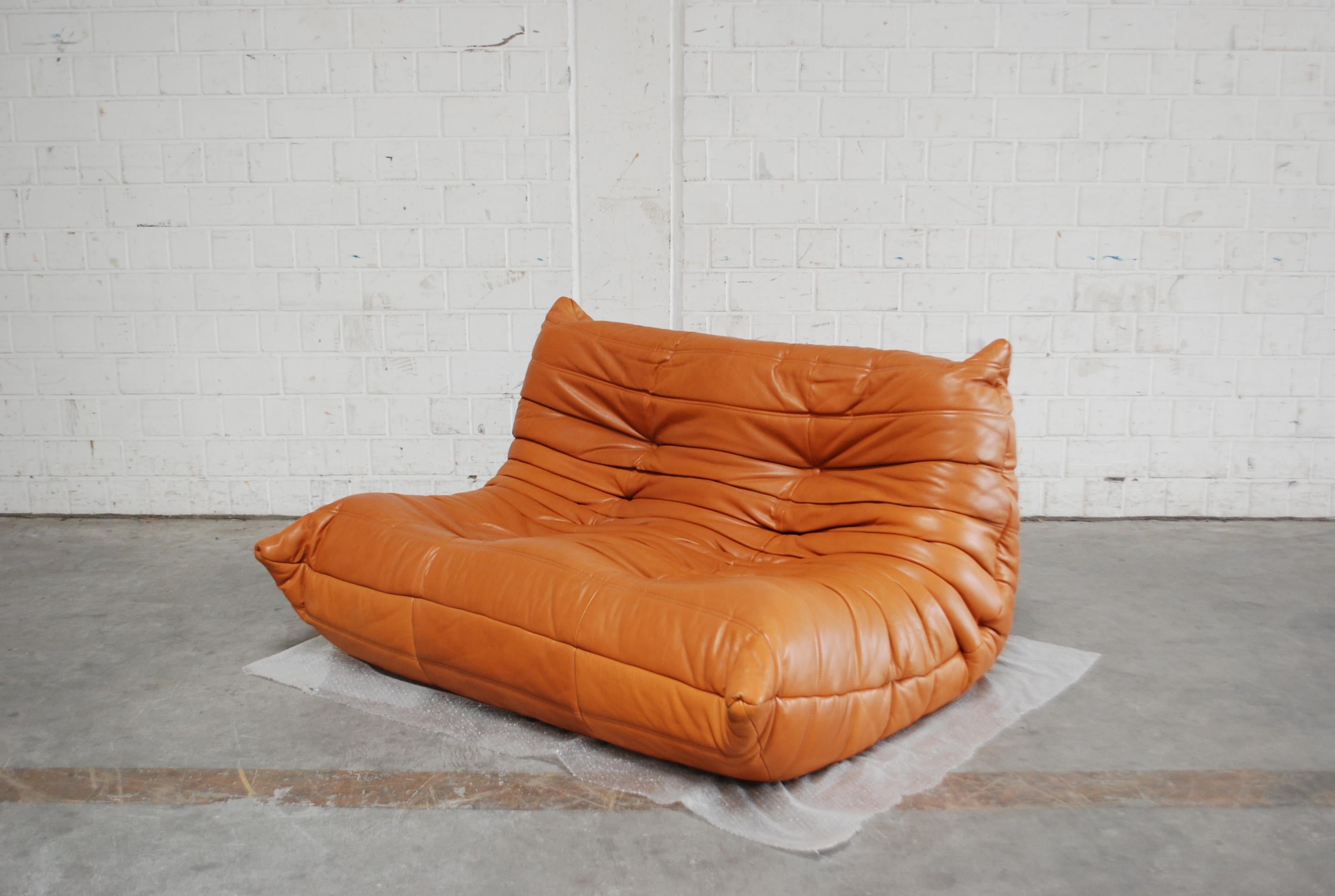 Ligne Roset Model Togo sofa in cognac brandy soft premium aniline leather.
Design by Michel Ducaroy.
Original leather with a soft touch.
From the late 1980s.
In a great condition. Hard to find this beautiful leather in this condition.
 