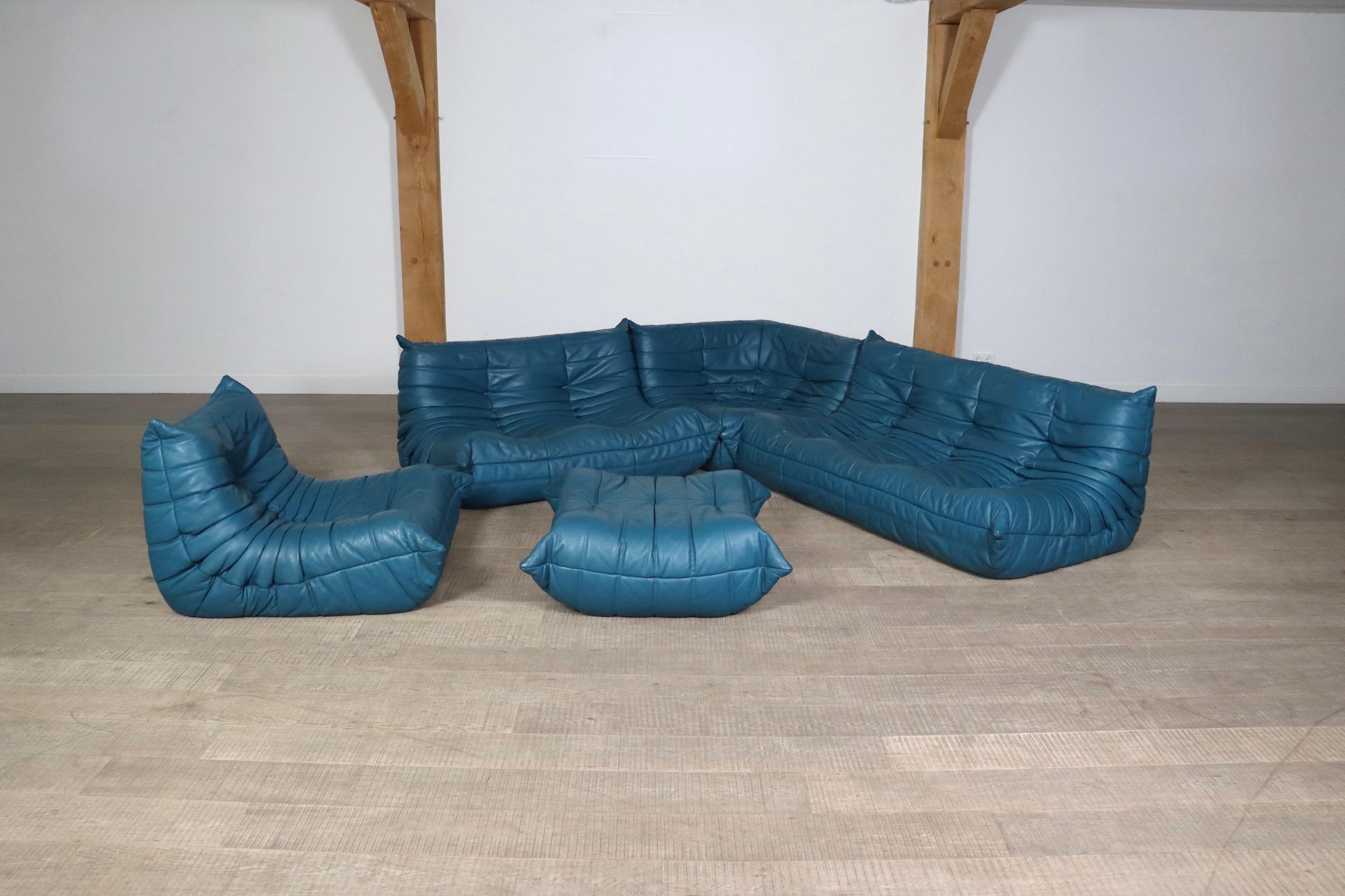 Amazing Ligne Roset Togo sofa set in original Petrol blue leather by Michel Ducaroy, 1970s. This iconic design has become more and more popular over the years. The lightweight design combined with fun colors and materials make these seating elements
