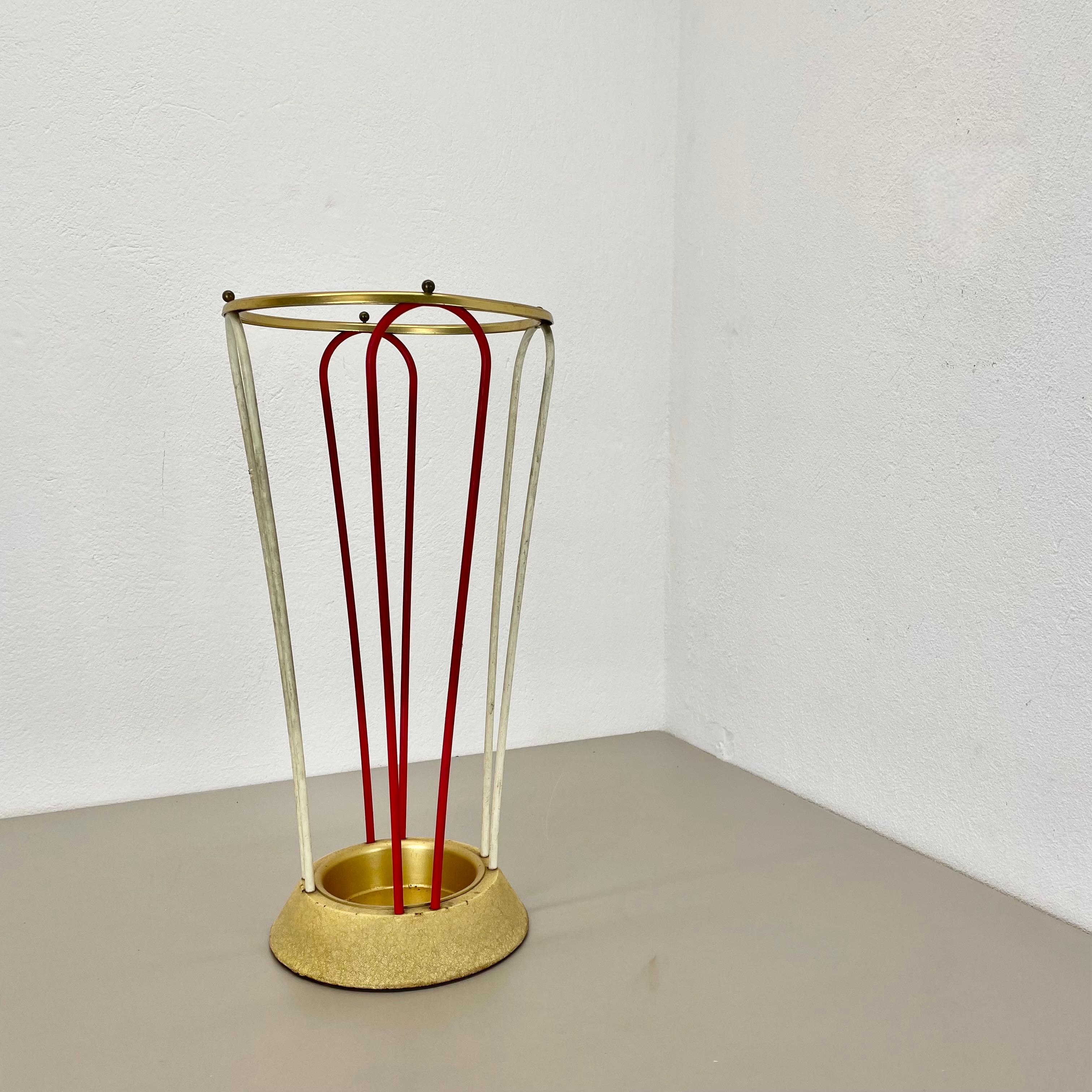 Article:

Bauhaus umbrella stand


Origin:

Germany


Age:

1950s


This original vintage Bauhaus style umbrella stand was produced in the 1950s in Germany. The umbrella holding element on the top are made of solid brass in a nice looped form, the