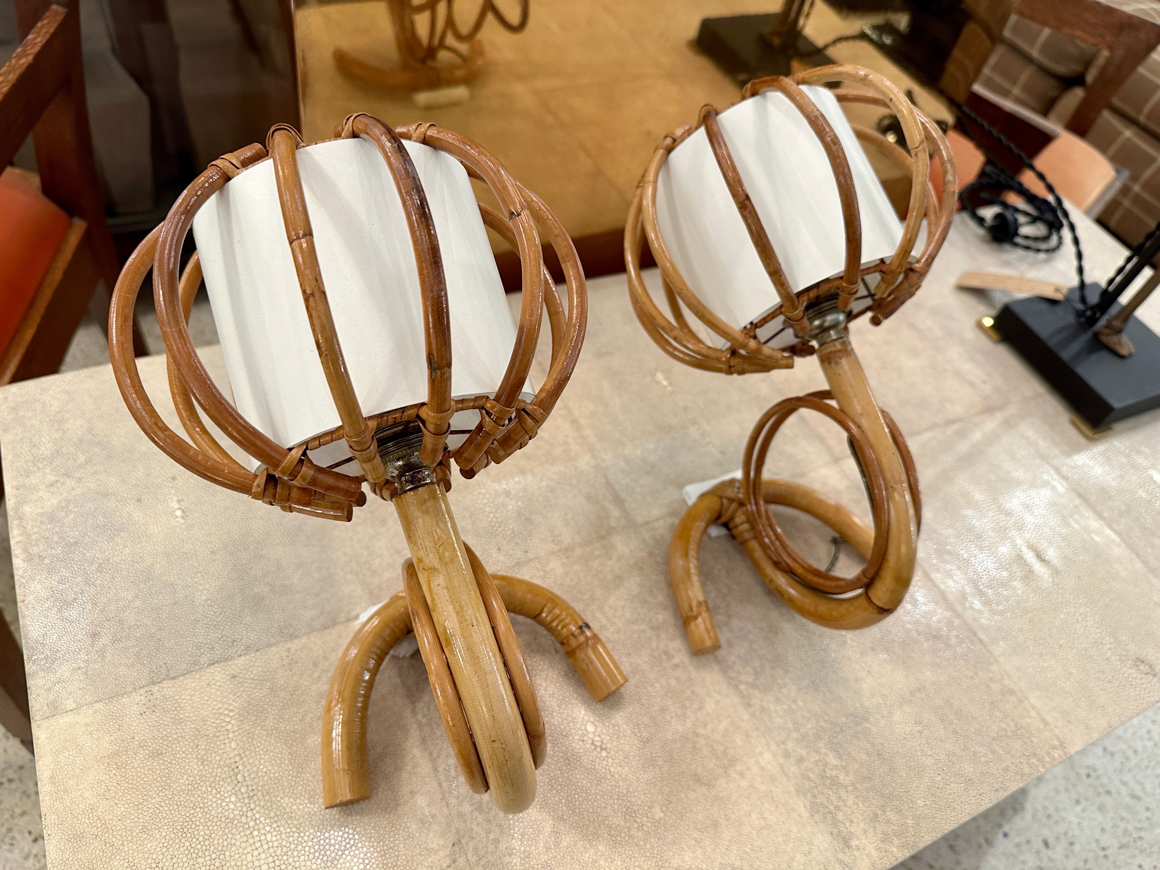 Beautiful vintage Louis Sognot “lantern” sconces from bent bamboo and parchment paper shades.  THIS ITEM IS LOCATED AND WILL SHIP FROM OUR MIAMI, FLORIDA SHOWROOM.