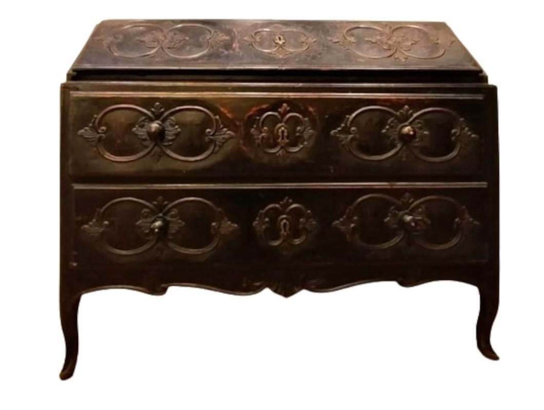 Original Louis XV carved sideboard with writing desk with dark patina finish.

Louis XV sideboard with writing desk with exquisite floral carvings carved from solid walnut, finished in dark patina.

Very nice original bronze vents.
The flap is