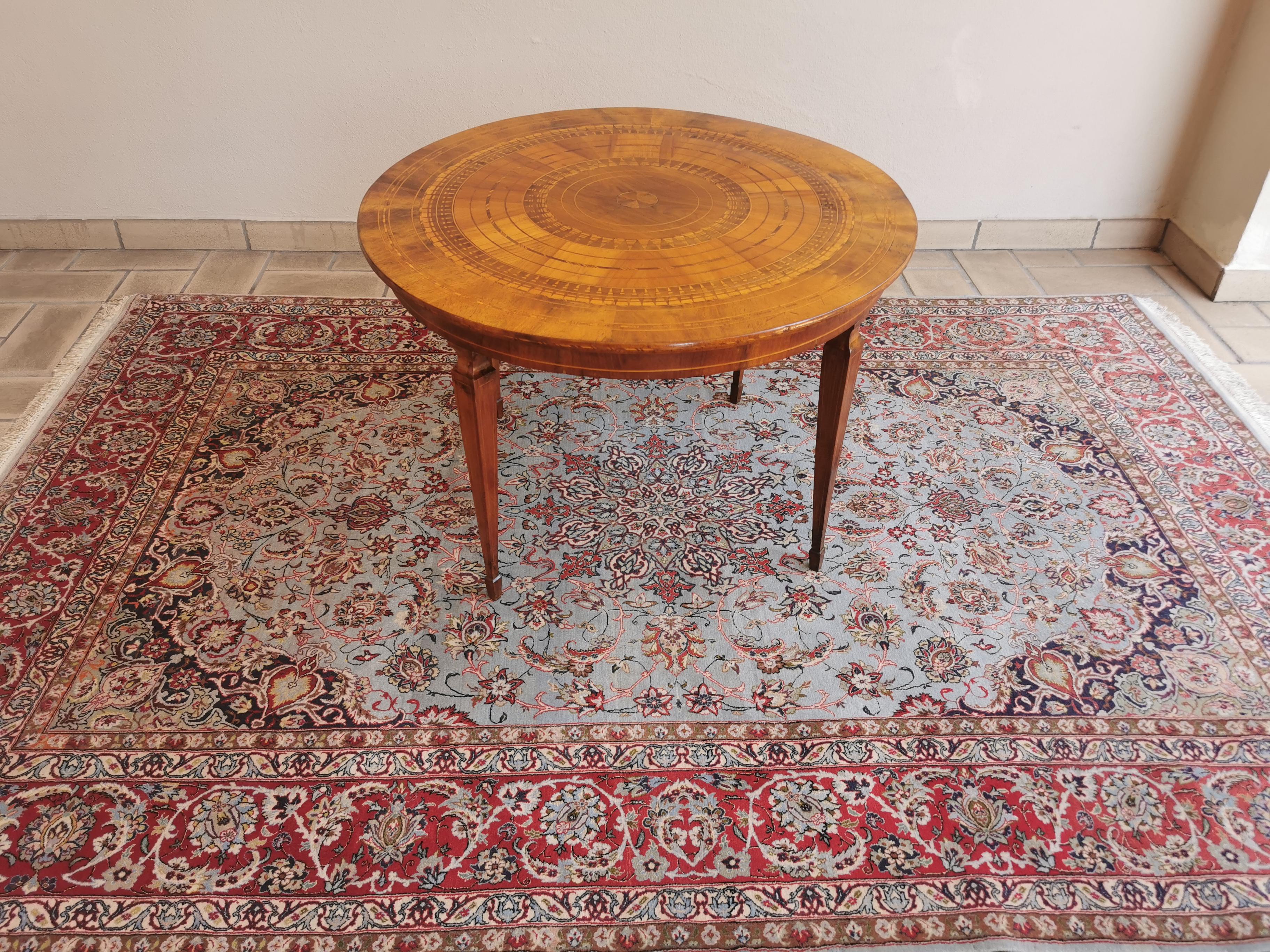 Original Louis XVI Marquetry center table can be used also as coffee table or sofa table. 
richly inlaid with walnut all around the table, particular piece in walnut and has been restored in a good way 
in good condition 
diameter 79 cm and