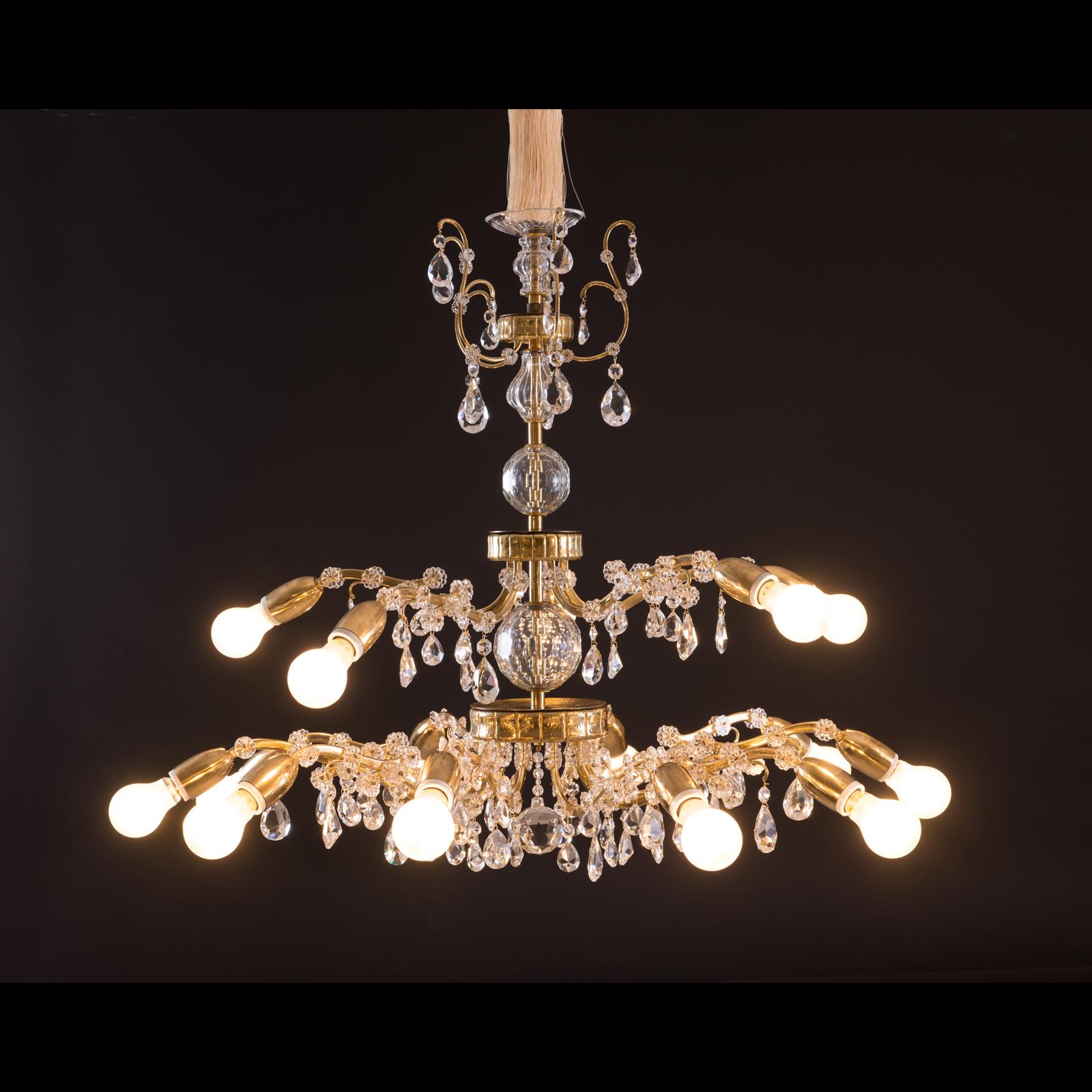 A very rich decorated Austrian, 1960s chandelier, tremendous handcraft with chased parts and handblown column and hand-cut crystal glass, 15 flames. The height is just the chandelier

Suitable for the US market
 