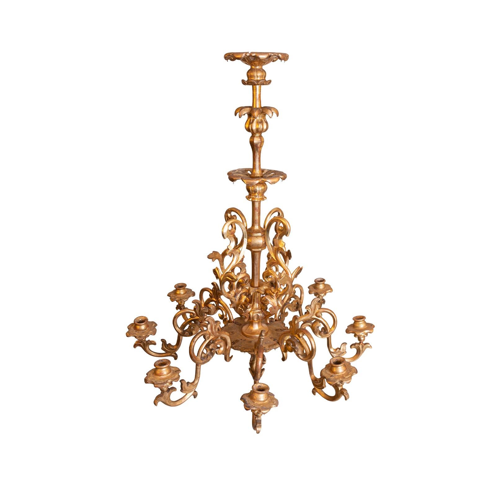 Unelectrified carved chandelier, leaf-gilded on poliment-ground, 8-flames. Newly restored. This is a original item of the time of Maria Theresia and Mozart

Can be electrified on demand suitable for US!.


