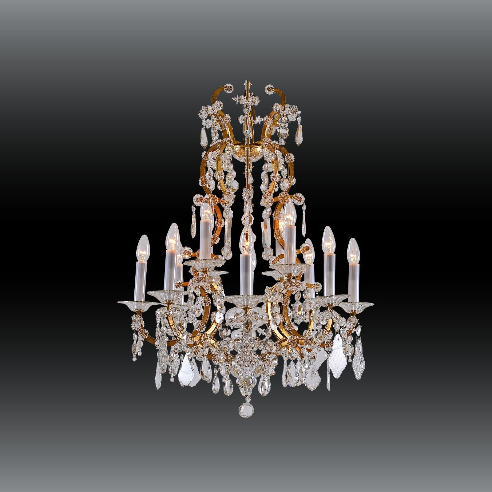 Very elegant glass-chandelier 
Material
forged iron gilded, crystal-glass.