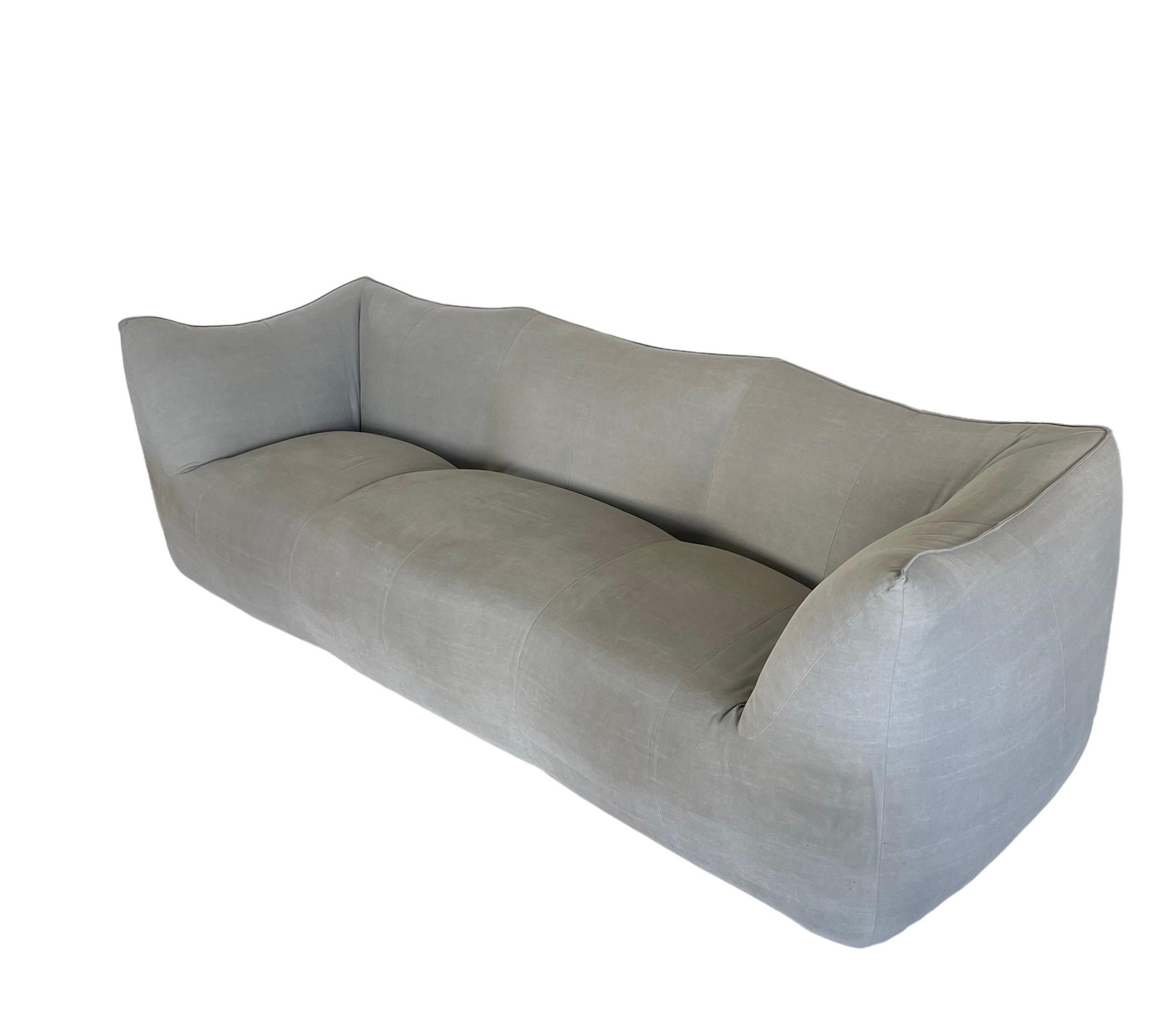 Timeless Le Bambole 3 seater sofa rendered in a metal structure covered in foam upholstered in a light grey linen fabric with burlap bottom retains original tag.  Designed by Mario Bellini for B&B Italia, Italy.