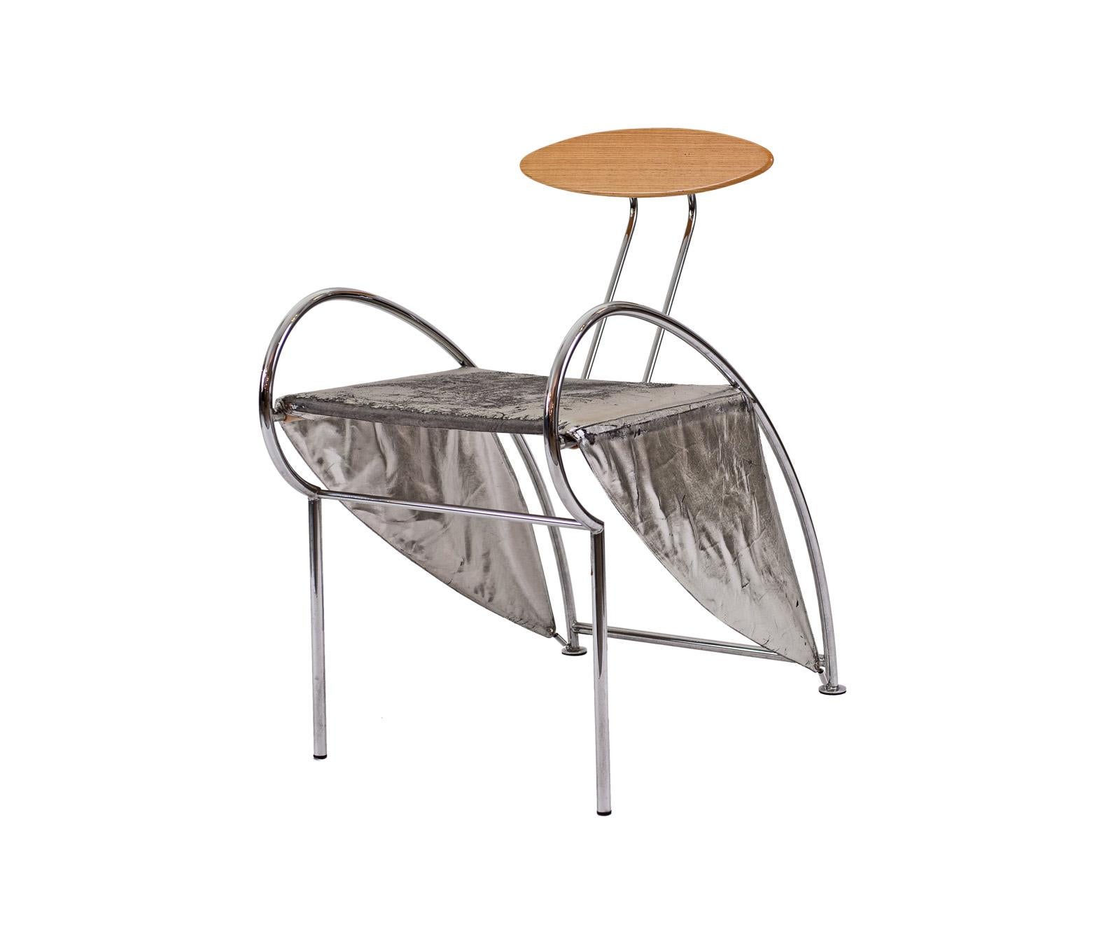 Very rare furniture-sculpture, Design: Massimo Iosa Ghini, Moroso, Milano, 1987. Literature: N. Bellati, Neues italienisches design, 1990.
Material used is leather in silver, wooden backrest.
