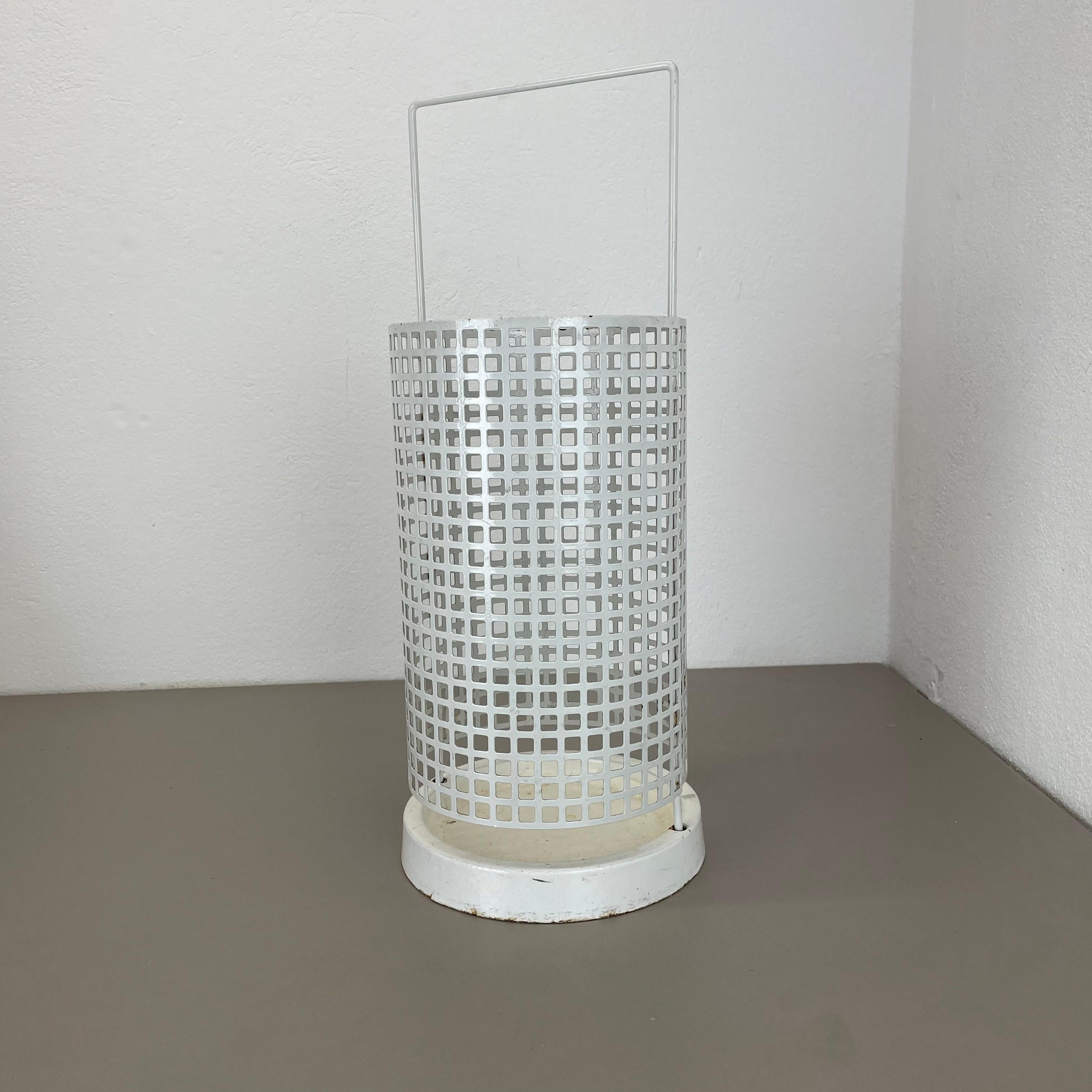 Article:

Umbrella stand


Description:

this original vintage Mategot style umbrella stand was produced in the 1970s in France. it is made of solid metal with hole pattern perforation optic and and white metal shell at the bottom.

straightforward