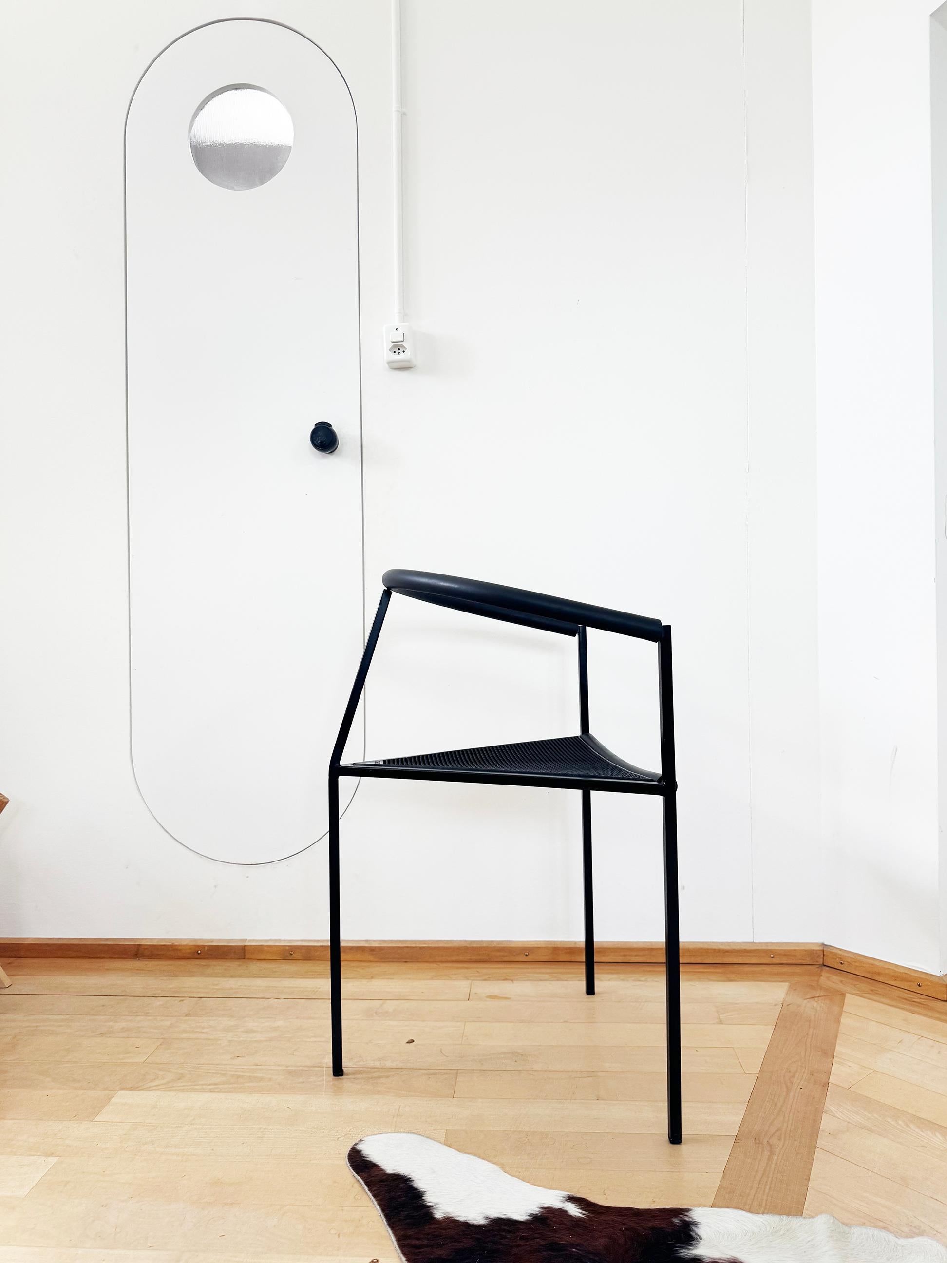Maurizio Peregalli and Sergio Calatroni designed this Post-modern chair for Zeus in Italy in 1985. 
It is a work of sculptural art. 

This Poltrona model features a black powder-coated square steel tube frame, a black self-skinning polyurethane