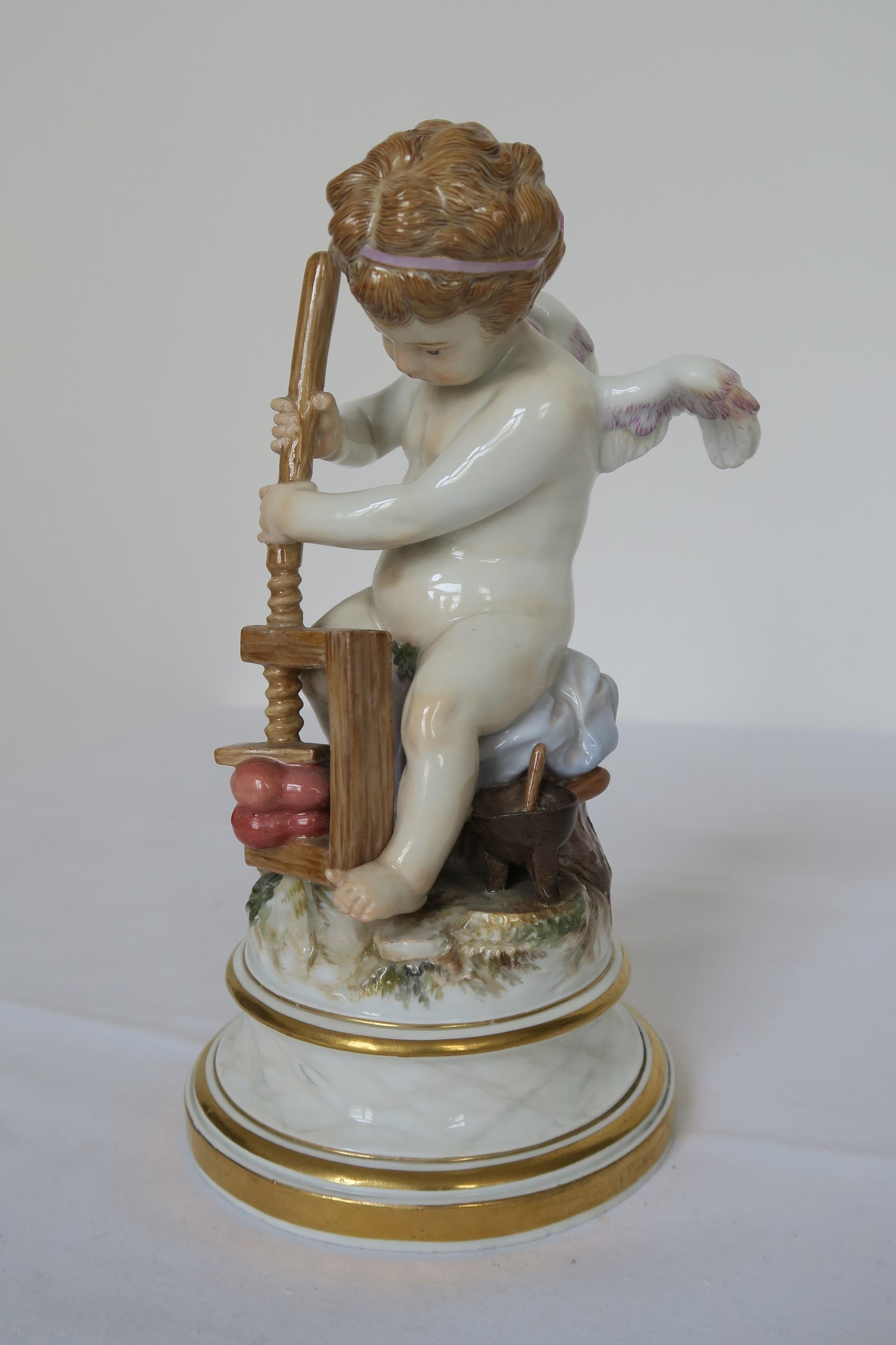 This is a beautiful figurine of a flush little cherub. He is sat on a grassy hill, squeezing two hearts together representing the merging of two people's loves and the possible agony that love can bring. It is made of porcelain by renowned German