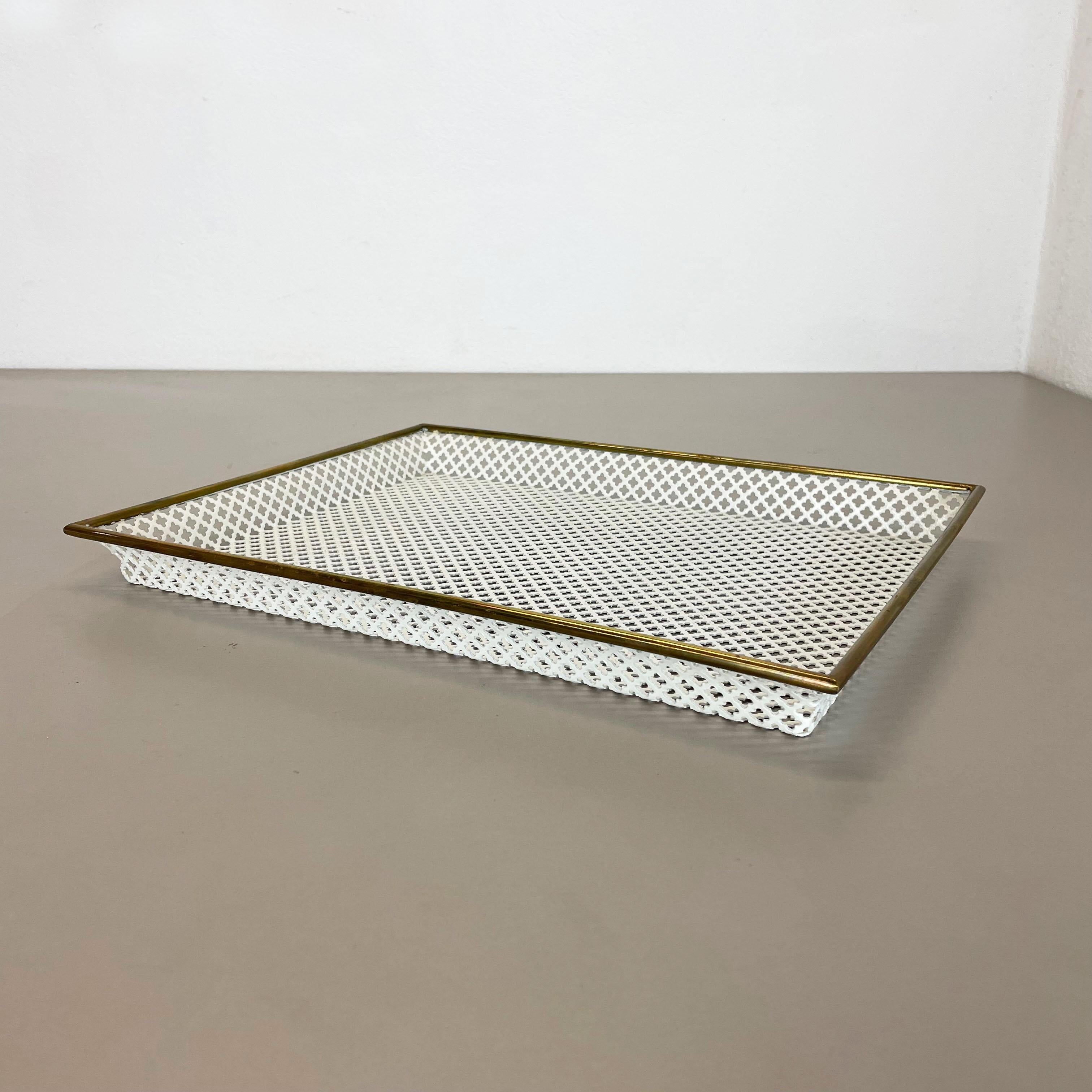 Article:

Tray element with hole pattern


Producer:

Vereinigte Werkstätten München


Origin:

Germany


Material:

metal and brass


Decade:

1950s


Description:

This original midcentury tray element was produced in