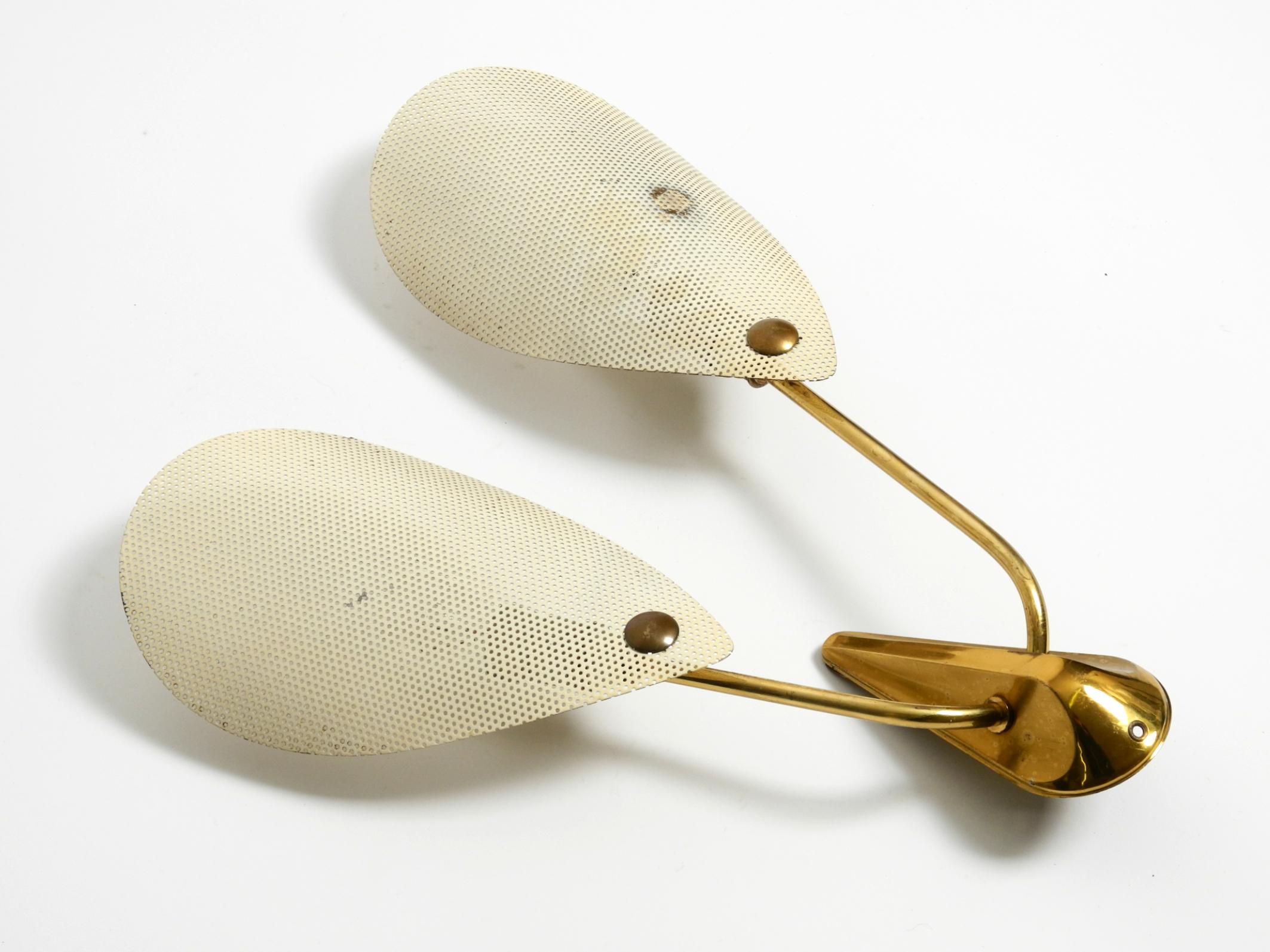 German Original Mid Century brass wall lamp with perforated metal sheet lampshades For Sale