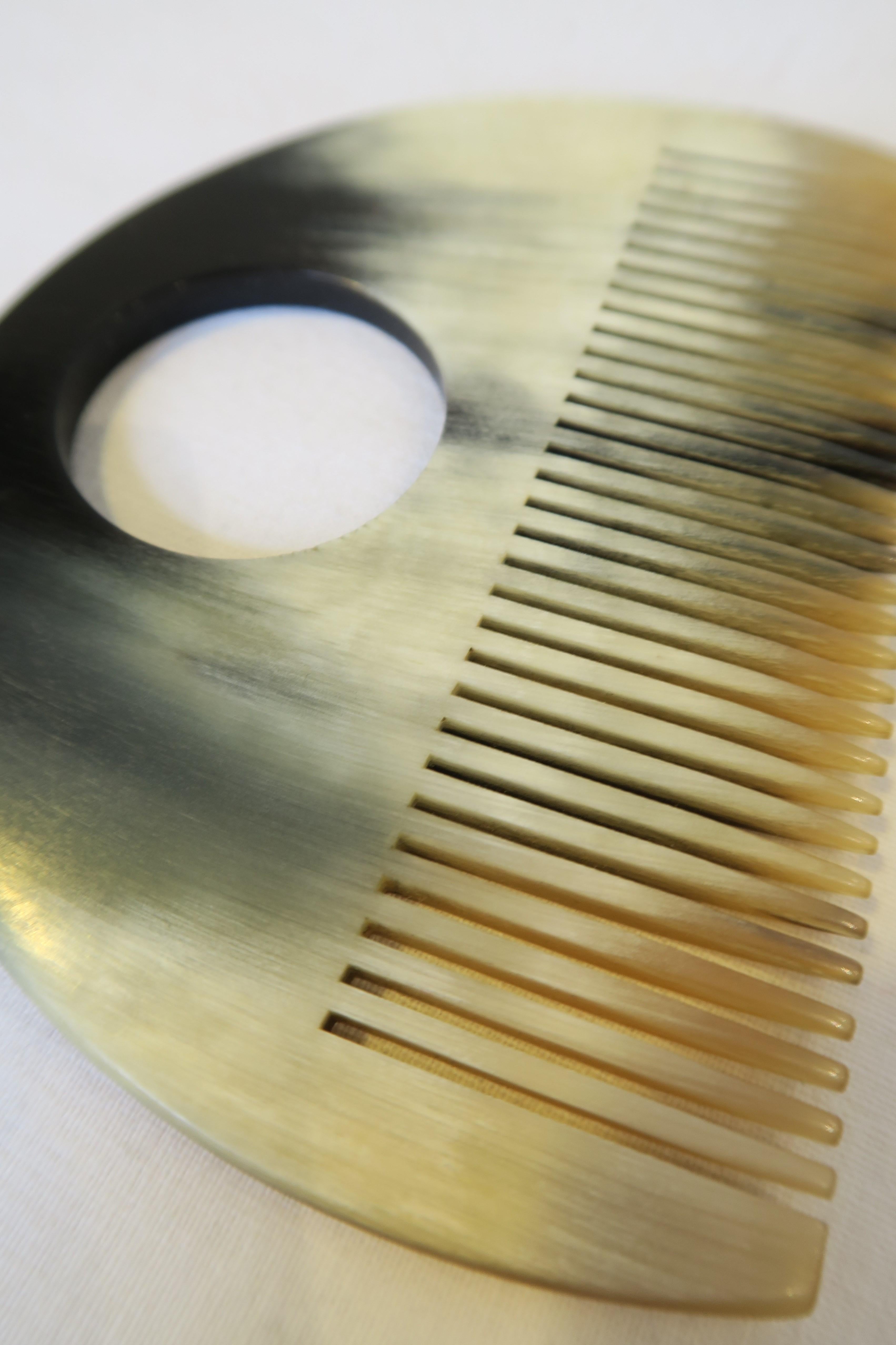For sale is a beautiful half-moon shaped comb. The item was hand-crafted from horn and designed by the renowned workshops of Carl Auböck in Austria. It's a remarkable example of the typical form-follows-function-style of the 50s and German Bauhaus,