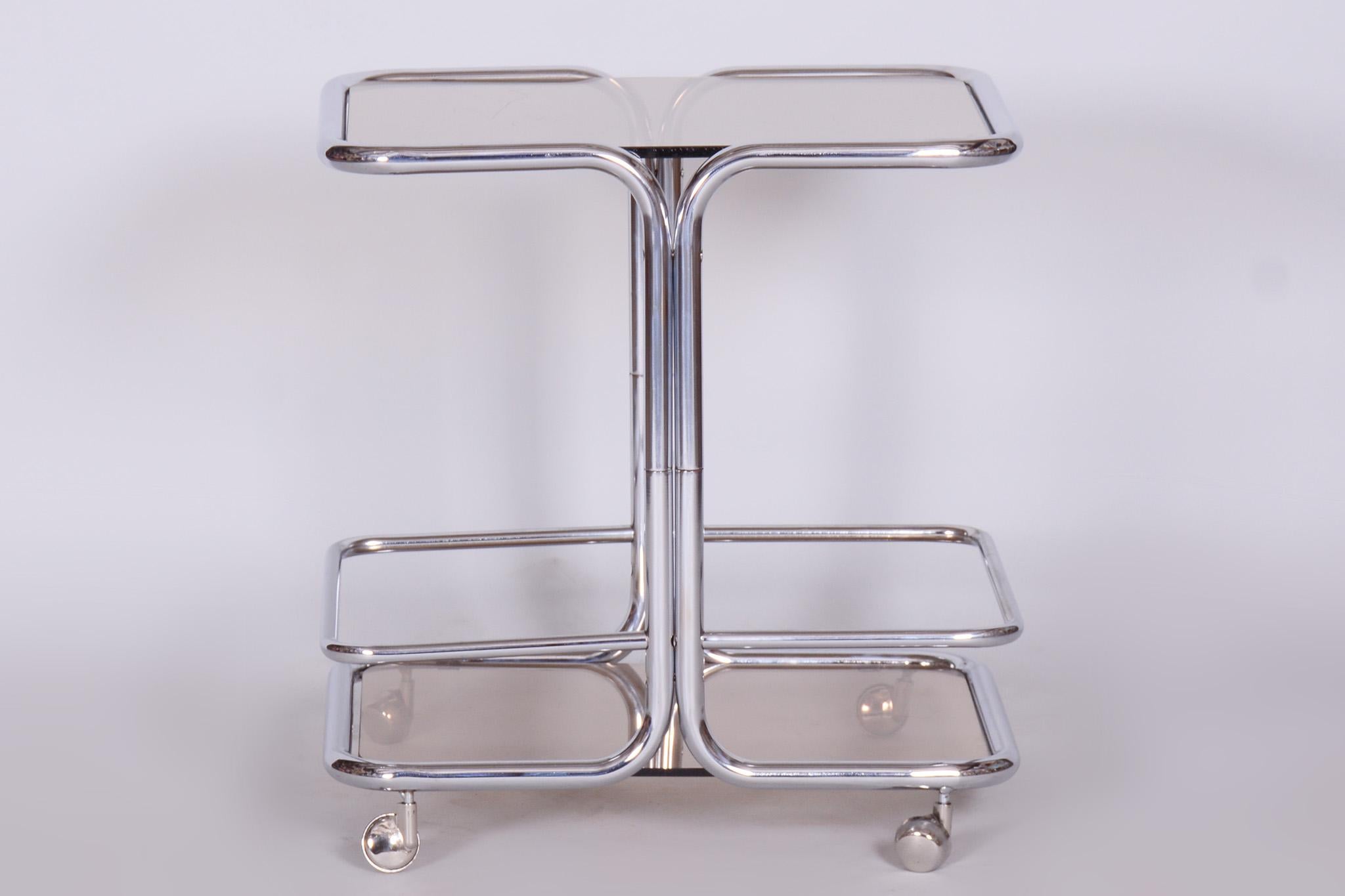 Original midcentury chrome serving trolley.

Period: 1960-1969
Source: Czechia
Material: smoked glass, chrome-plated steel

Original very well-preserved condition.