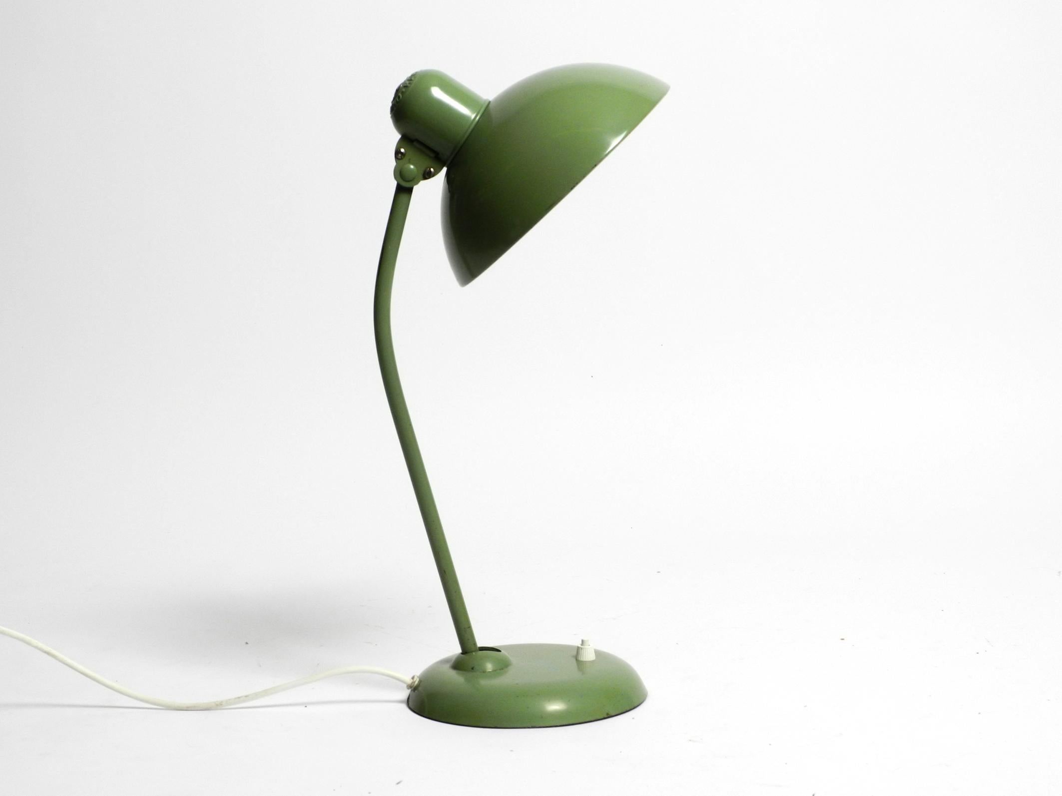 Original Mid Century Modern Kaiser Idell Industrial Metal Table Lamp.
Very rare in this color of original industrial green.
100% original condition and fully functional.
Great industrial design in very good vintage condition with a beautiful