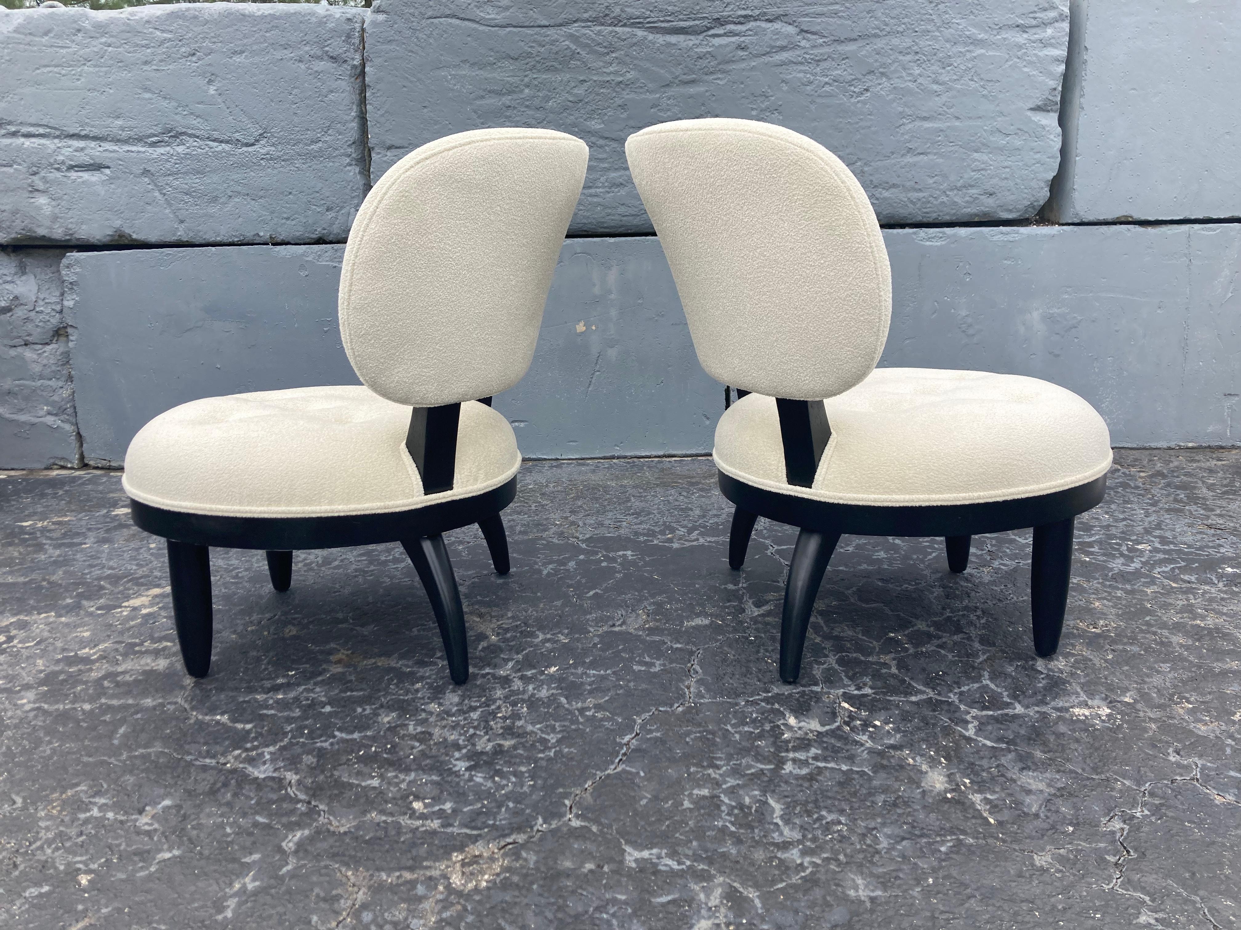 Beautiful pair 1950s Lounge chairs, black painted legs and frame. Foam is new and chairs were recovered in boucle fabric. Ready for a new home.