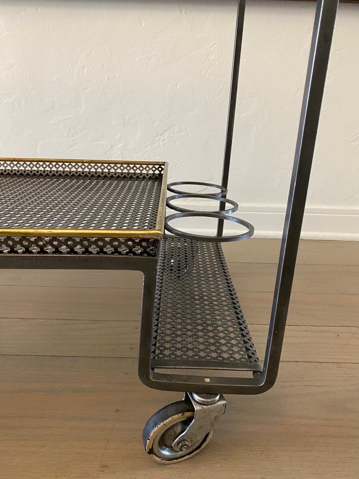 Amazing original vintage French modernist trolley made in the 1950's by Mathieu Mategot. It is made with his trademark bent metal rigitulle adding a whimsical effect. He designed furniture and objects for a short time, in 1960 he went back to