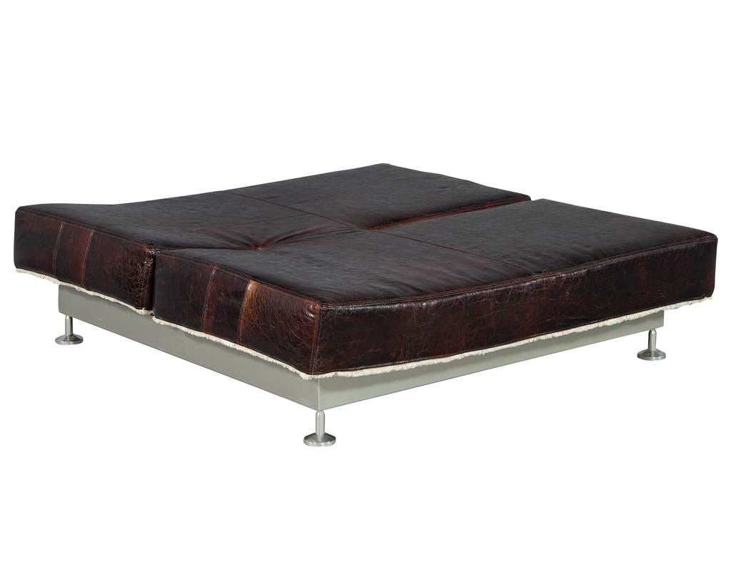 Original midcentury French leather daybed. This unique piece hails from Paris, France and features newly upholstered distressed leather and a shag soft white rear fabric. It has the ability to lock the foot and backrest into different positions for