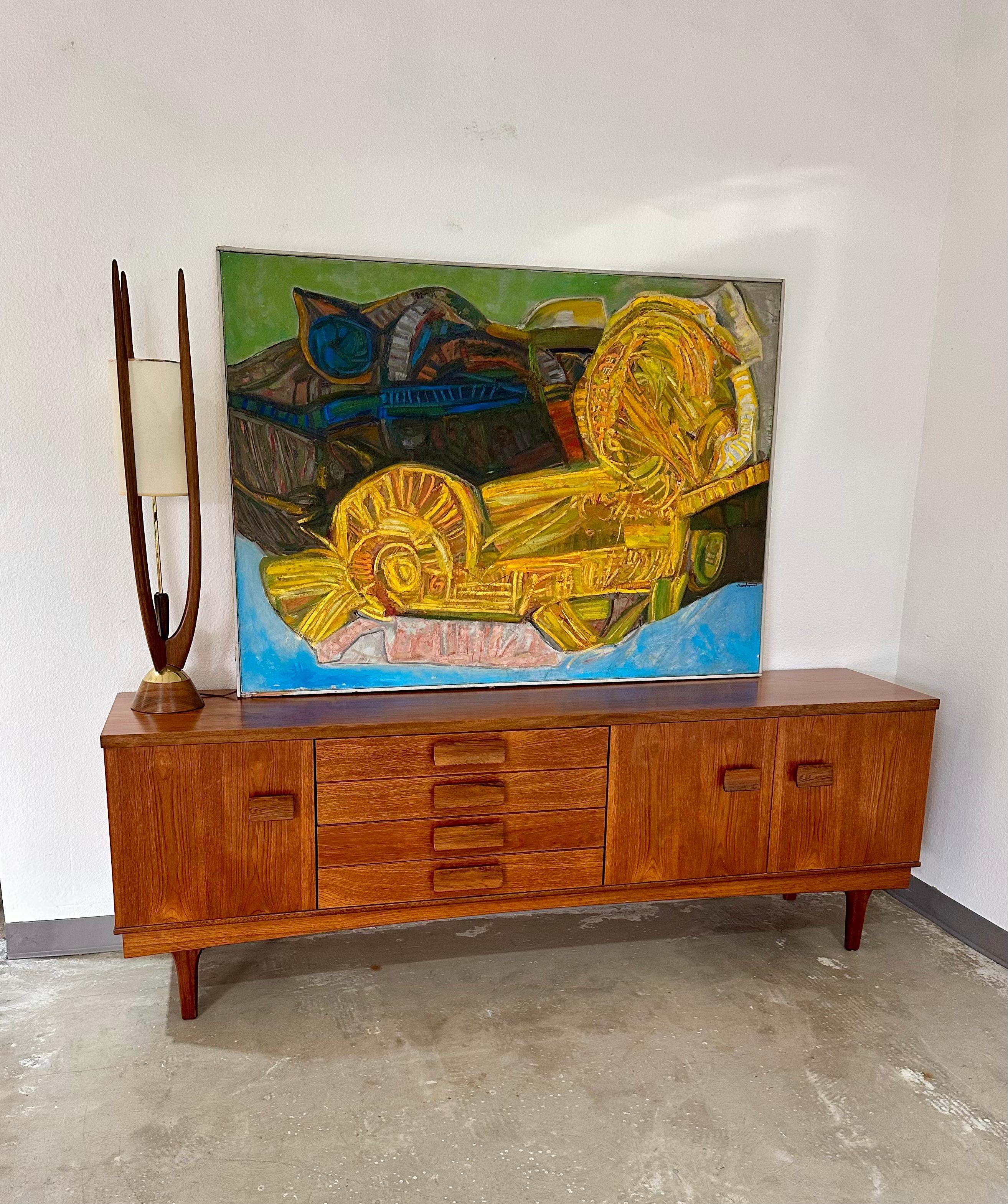Peinture abstraite de Jose Guadiana (1929-2012), une composition dynamique en bleu, jaune, vert et marron. Peinture à l'huile à fort empâtement sur toile, châssis en bois avec cadre simple en bois gris. Signé et daté au dos. D'autres grandes