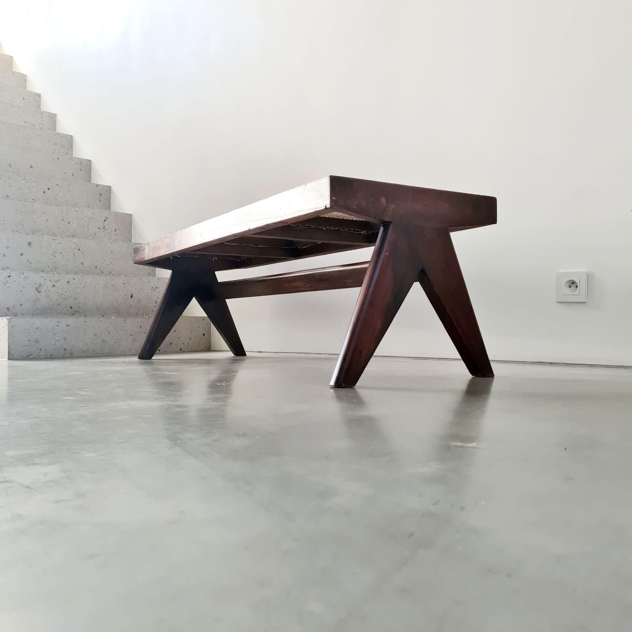 A scarce bench by design legend Pierre Jeanneret for Chandigarh. 

India, c1950s. 

PJ-SI-33-C model. 

Formed from Teak and Cane, the bench has been sympathetically restored to retain its functionality and its history. 

A central stretcher