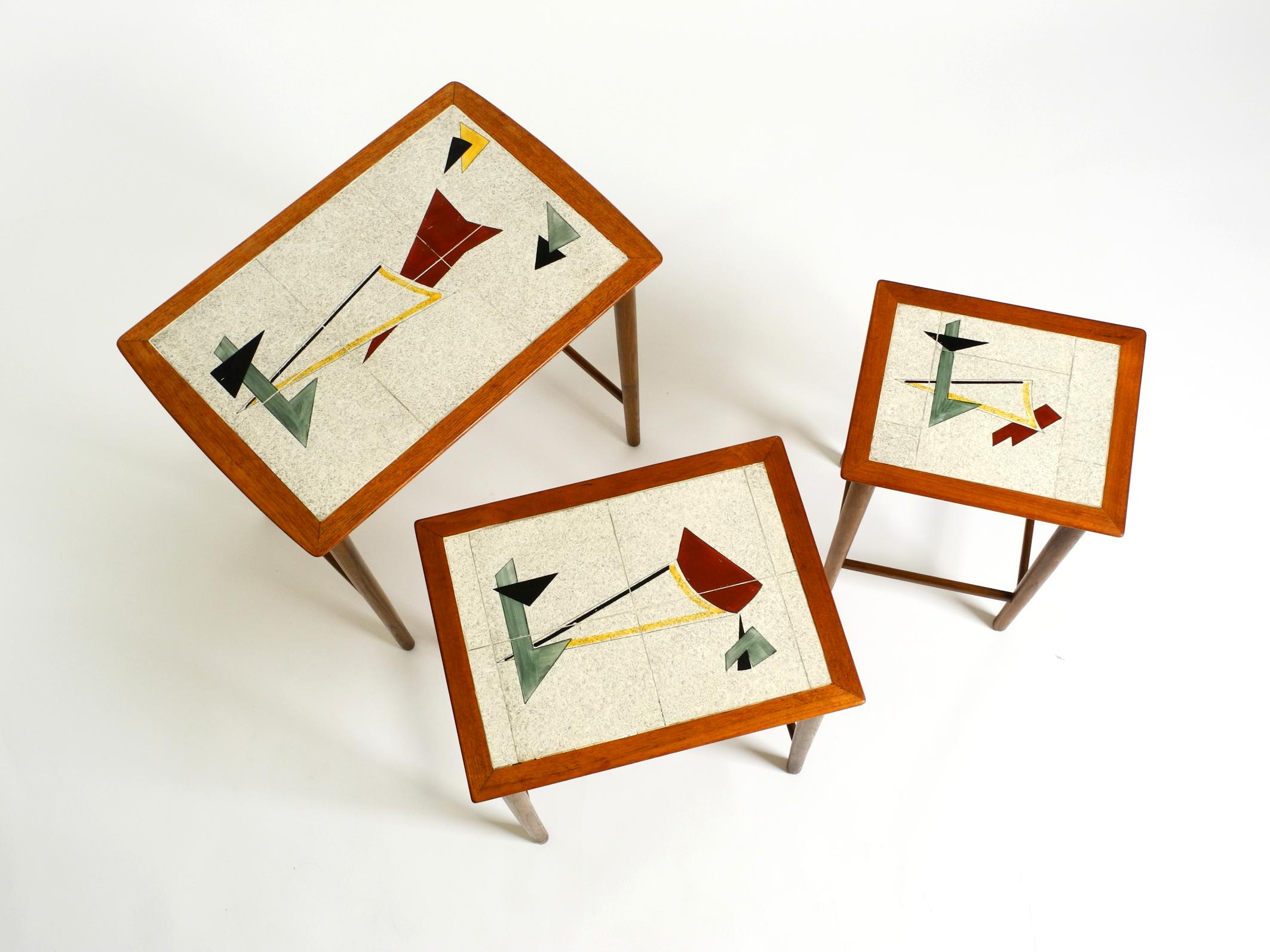 Mid-20th Century Original Mid Century set of 3 teak nesting tables with colorful Formica surfaces