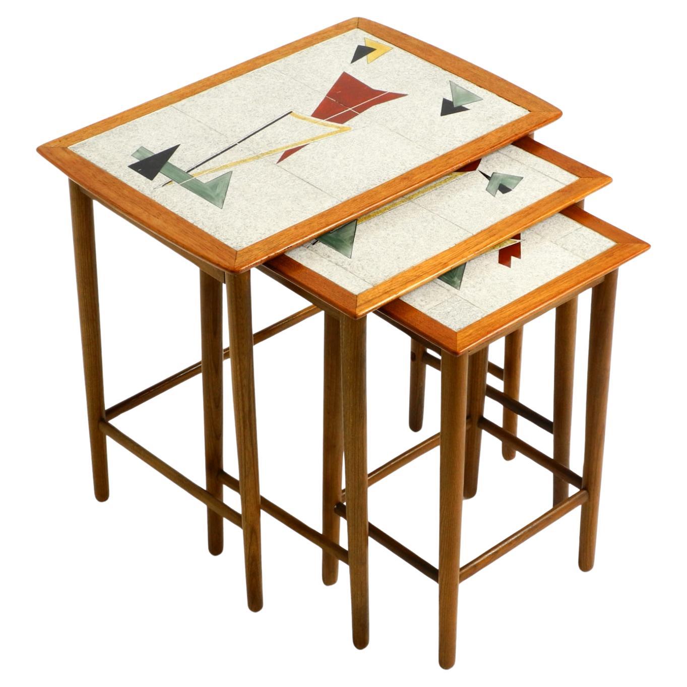 Original Mid Century set of 3 teak nesting tables with colorful Formica surfaces