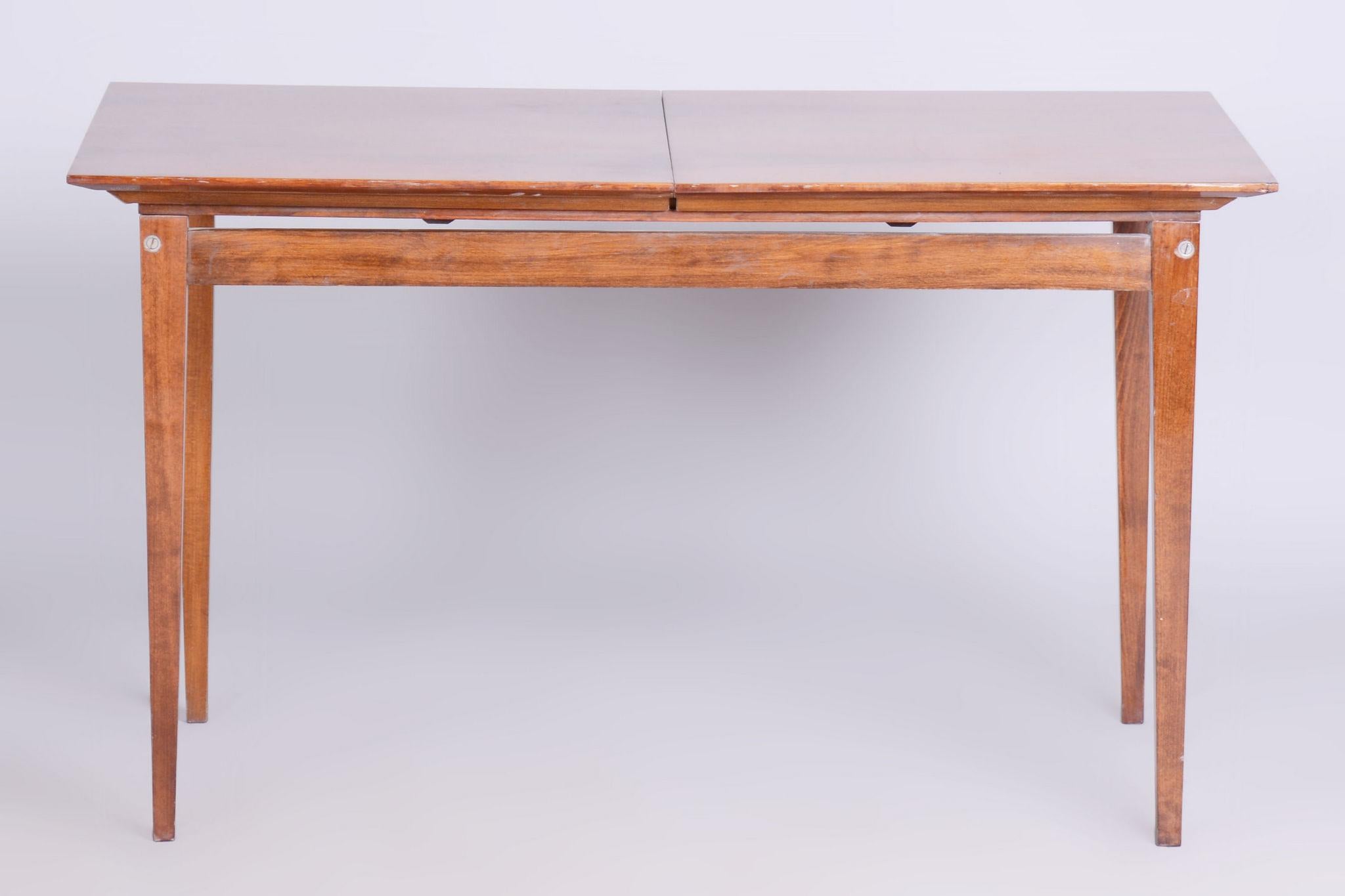 Original Mid-Century folding table.

Source: Czechoslovakia 
Period: 1950-1959
Material: Walnut
Maker: Mier Topolcany

The depth after unfolding is 180 cm. 

In pristine original condition, the item has been professionally cleaned, and its polish