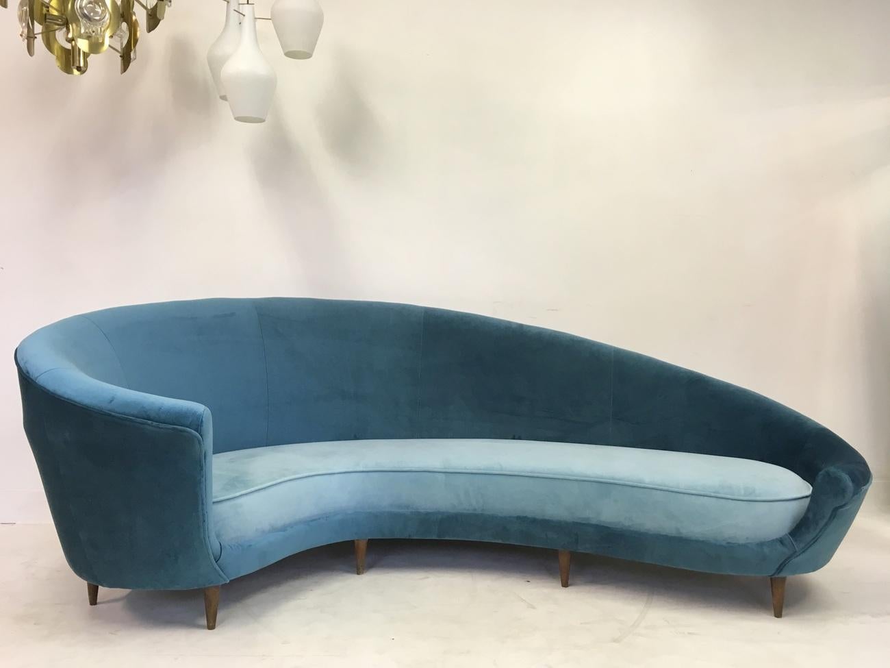 Original curved sofa
In the style of Federico Munari
Turned conical legs
New two tone blue velvet upholstery
Italian
Measure: 35cm seat height.