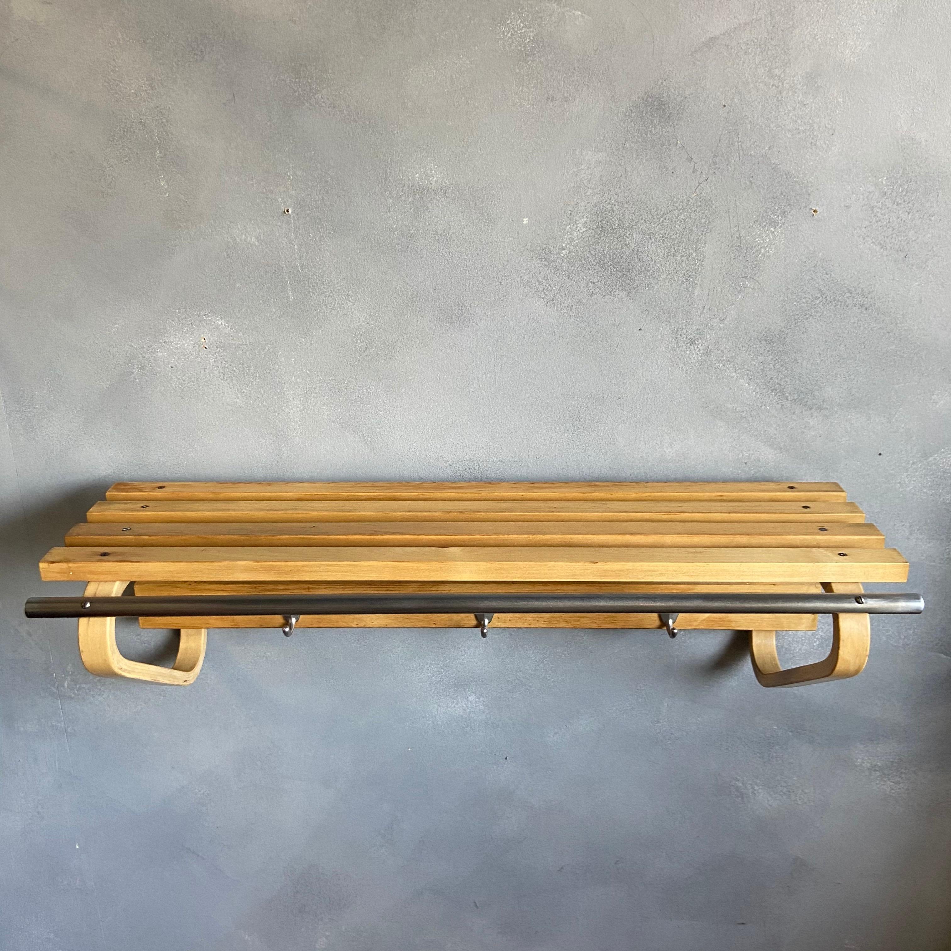 For your consideration is this original coat rack with shelf designed by Alvar Aalto for Artek circa 1960 featuring birch wood, metal coat hooks and early nickel plated steel hanger rod. We have been lucky to receive a few of these in our shop among