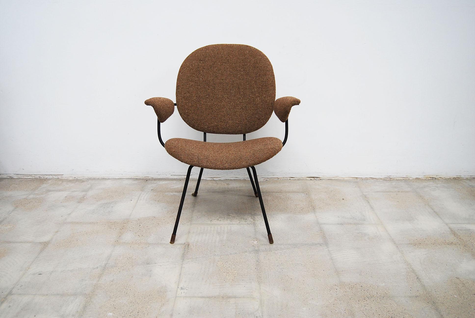 This original Kembo chair was produced by Dutch Gispen in the 1950s still covered in original woolen upholstery, in good shape with a small wear in the fabric in the seat.

This light footed cocktail chair was frequently used in home interiors tea