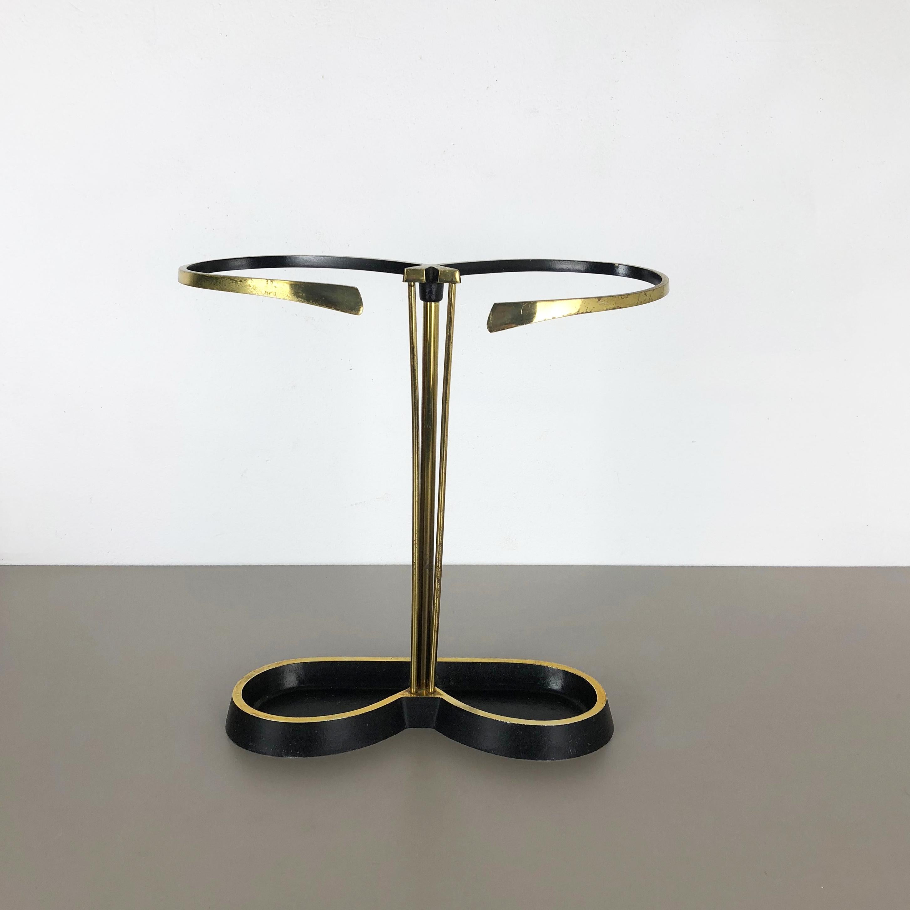 Article:

Bauhaus umbrella stand


Origin:

Austria


Age:

1950s


This original vintage Bauhaus style umbrella stand was produced in the 1950s in Austria. It is made of solid metal with brass applications at the top and upright