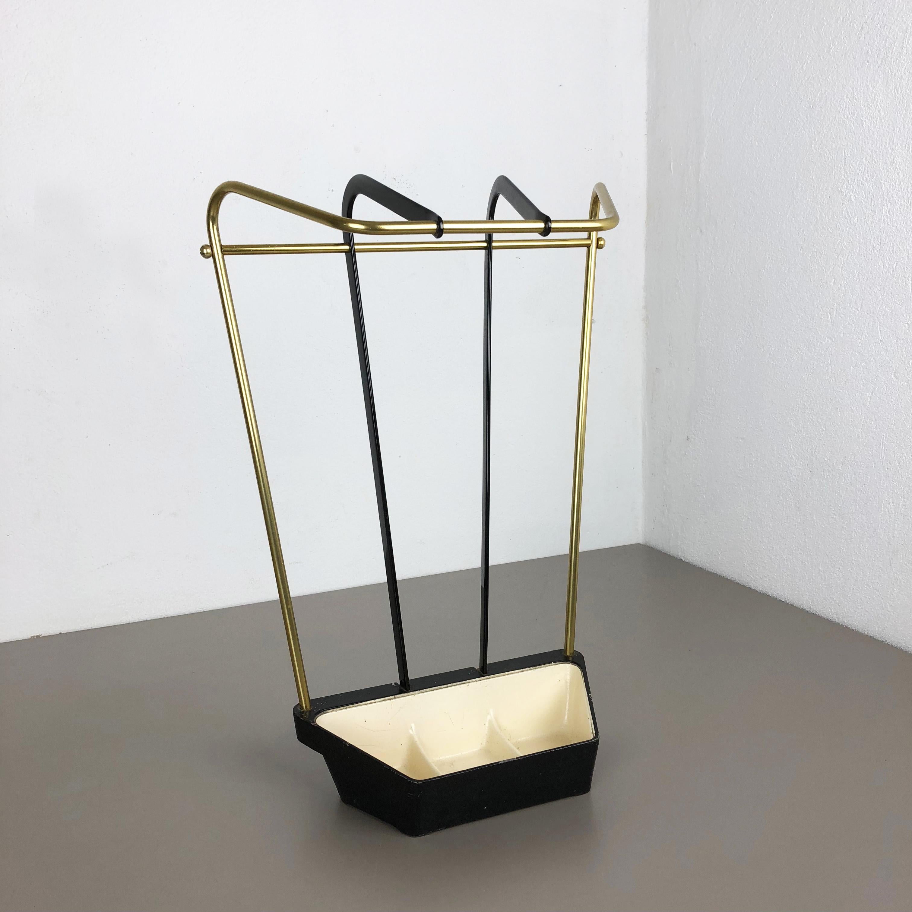 Article:

Bauhaus umbrella stand


Origin:

Germany


Age:

1950s


This original vintage Bauhaus style umbrella Stand was produced in the 1950s in Germany. it is made of solid metal with brass applications at the top and upright Stand, the heavy