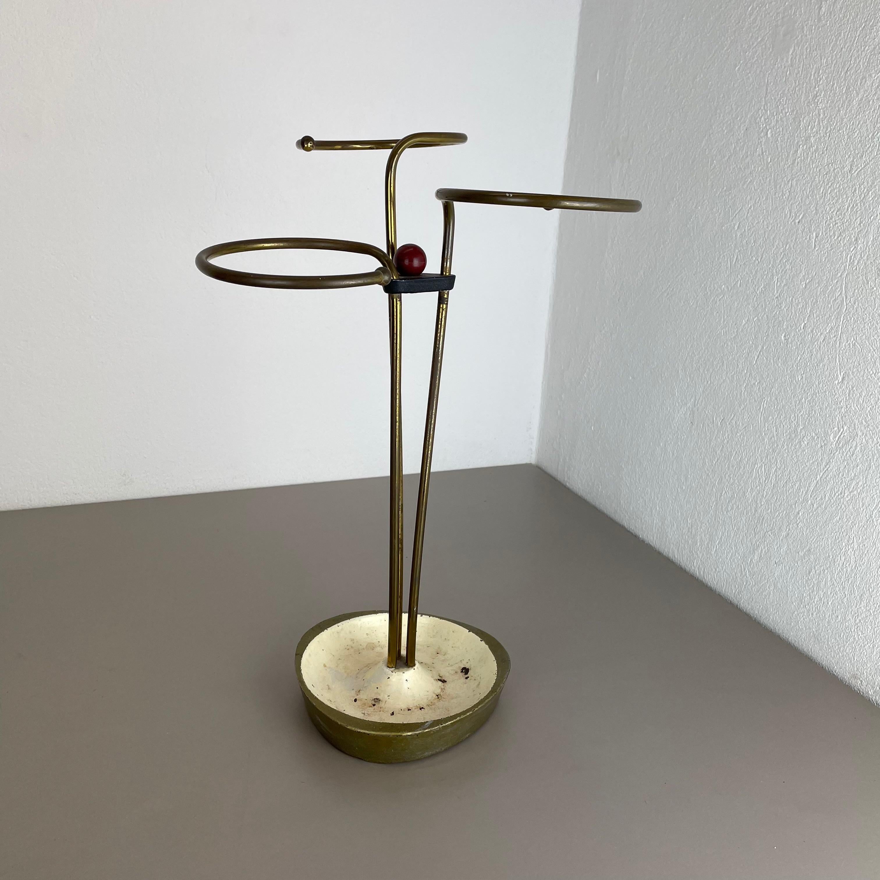 Article:

Bauhaus umbrella stand


Origin:

Germany


Age:

1950s


This original vintage Bauhaus style umbrella stand was produced in the 1950s in Germany. The umbrella holding element on the top are made of solid brass in a nice
