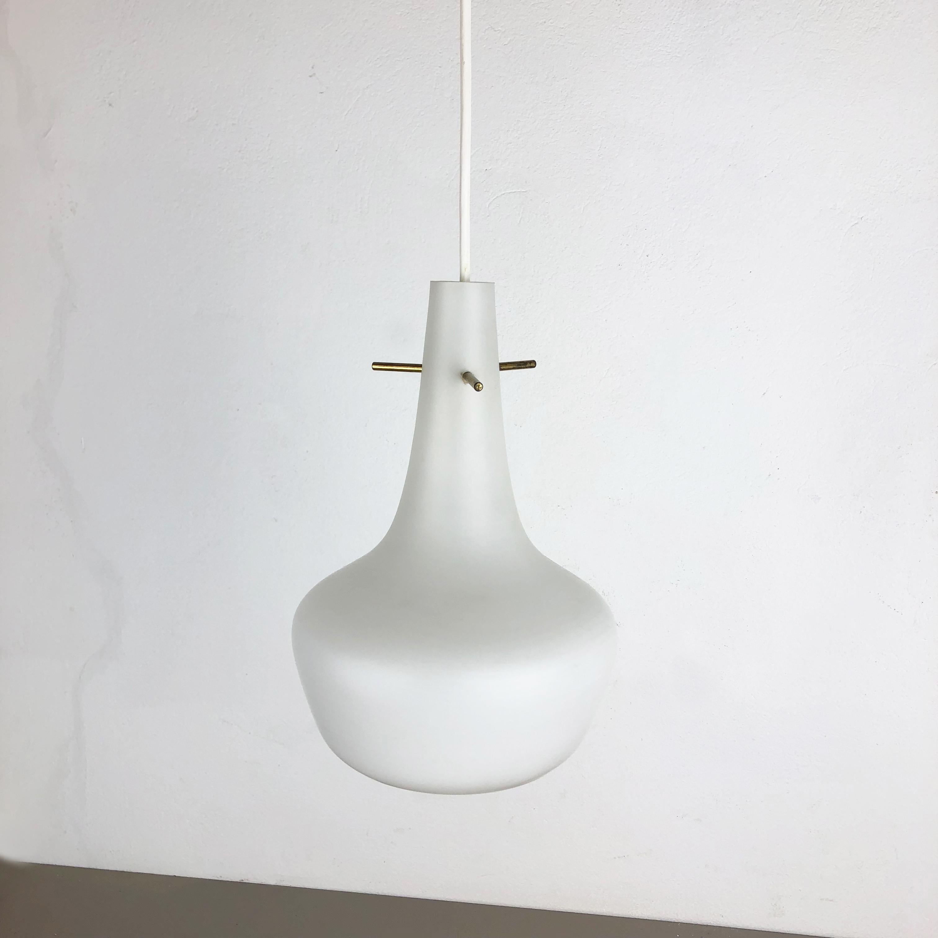 Article: Hanging light 


Origin: Italy


Age: 1960s 


 

This fantastic glass tube hanging light was designed and produced in 1960s in Italy. The shade is made of high quality opal glass, with a nice brass hanging compartment with three fixing