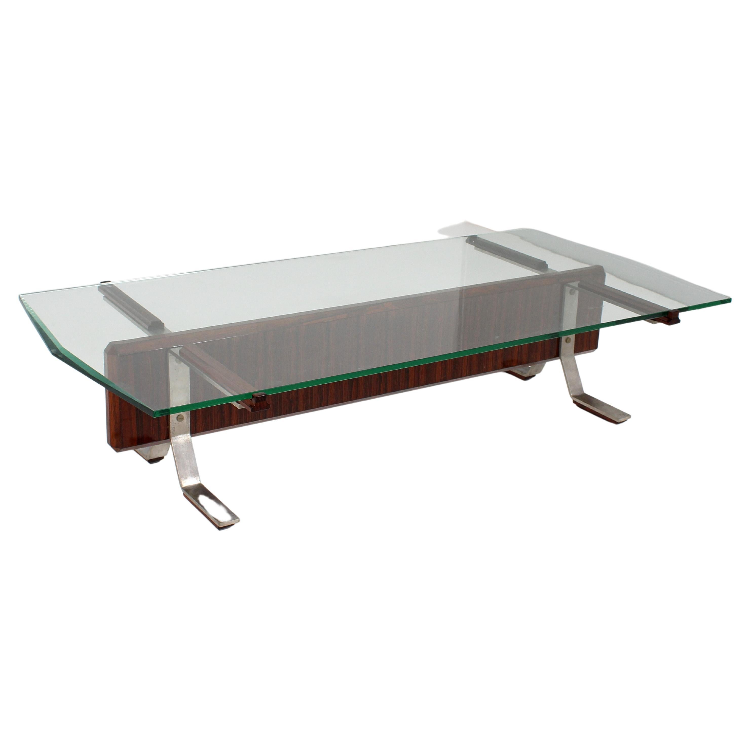 Elegant geometric coffee table with shaped top in ground glass with lateral facets, wooden structure with supports in bent steel bars. Present label with trademark. Production Mim Roma, attributable to Ico Parisi, Italy 60s. Restored.
Wear