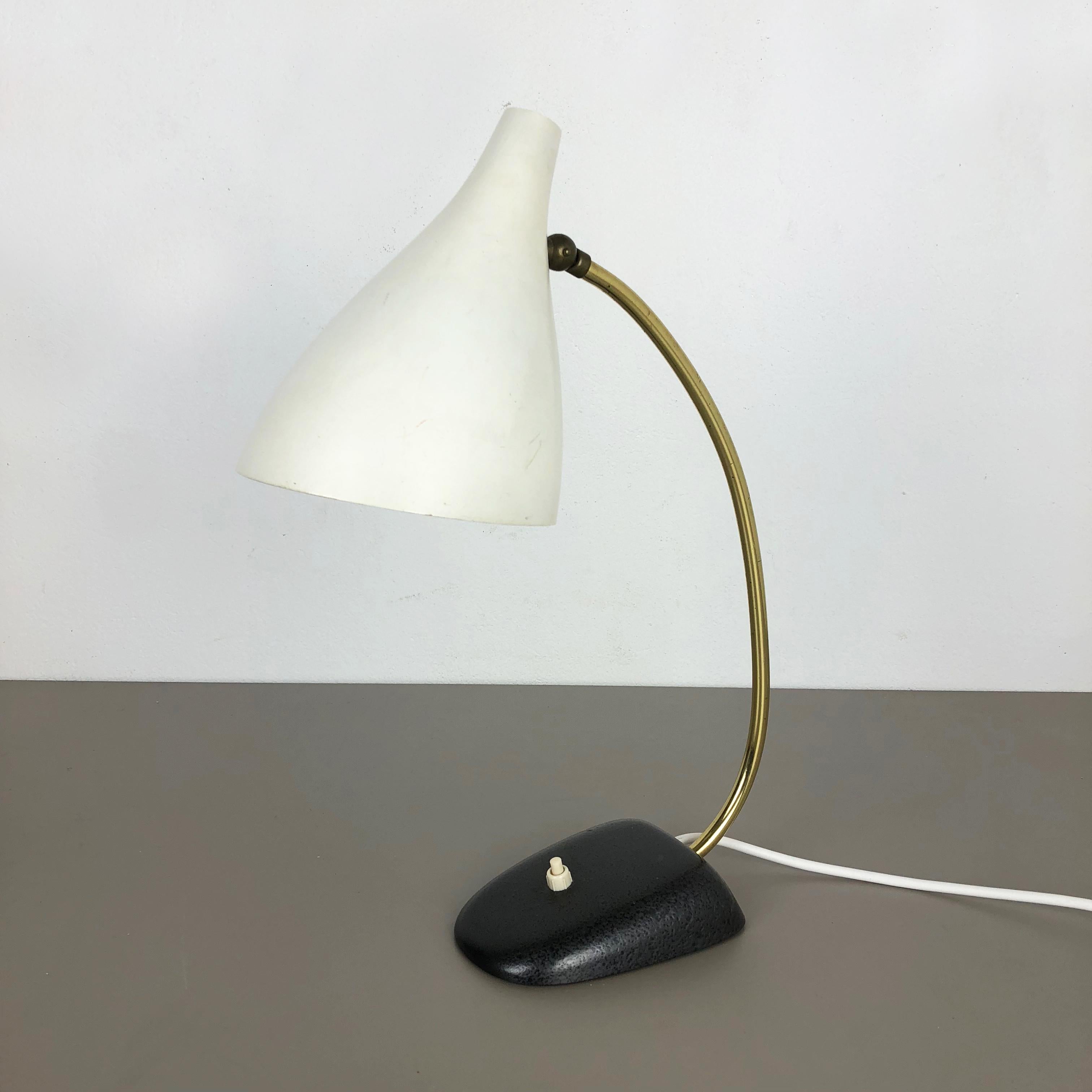 Article:

Table light


Origin:

Germany


Producer:

Cosack lights, Germany


Material:

Metal


Age:

1960s



Description:

This original 1970s table light made by Cosack in Germany. This minimalist table light has a
