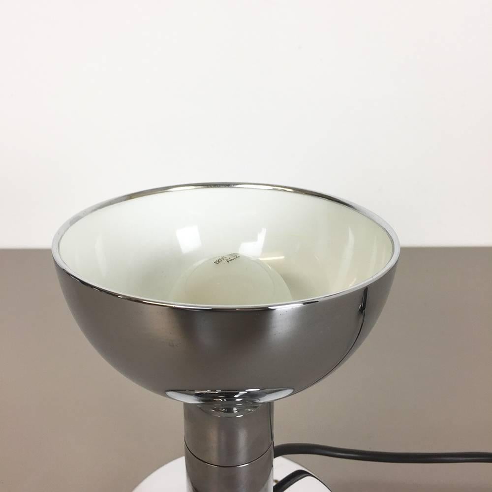 Article:

Table light


Origin:

Germany


Producer:

Cosack lights, Germany


Material:

Metal


Age:

1970s



Original 1970s chrome table light made by Cosack in Germany.
The light has a chrome metal base with one