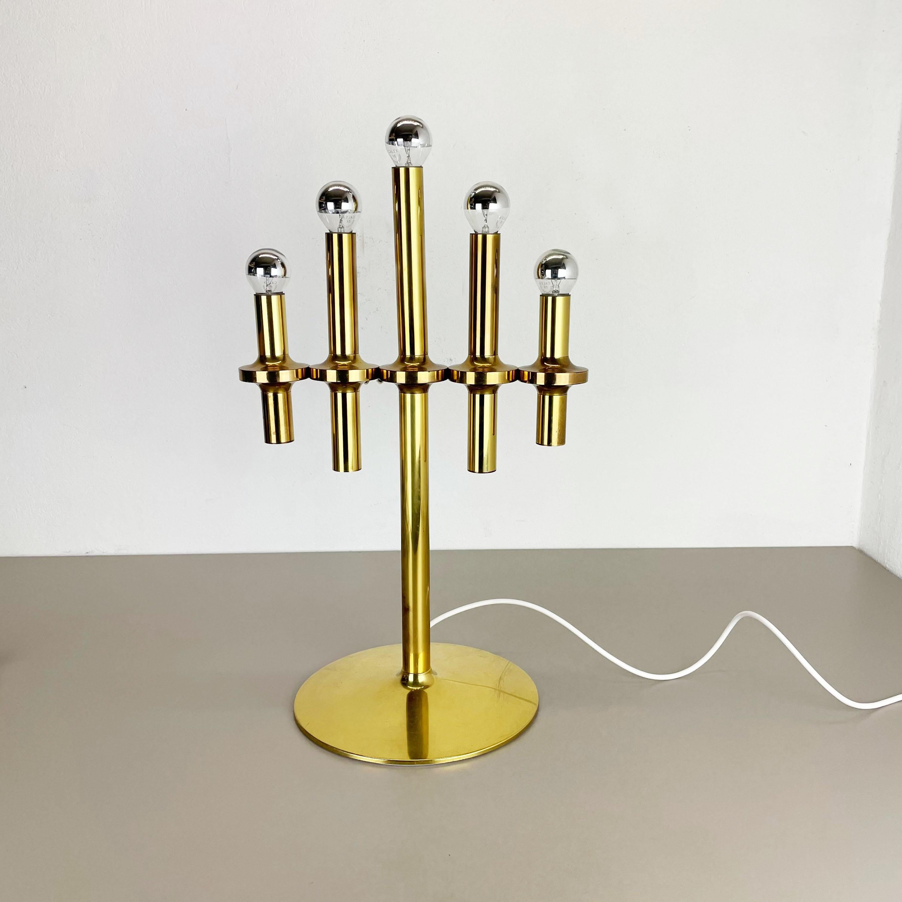Article:

Table light


Origin:

Italy


Age:

1970s


Original 1970s table light made in Italy. This wonderful modernist 1970s table light is made of solid brass and comes with a huge 5 arm tube element for light bulb. on the top of