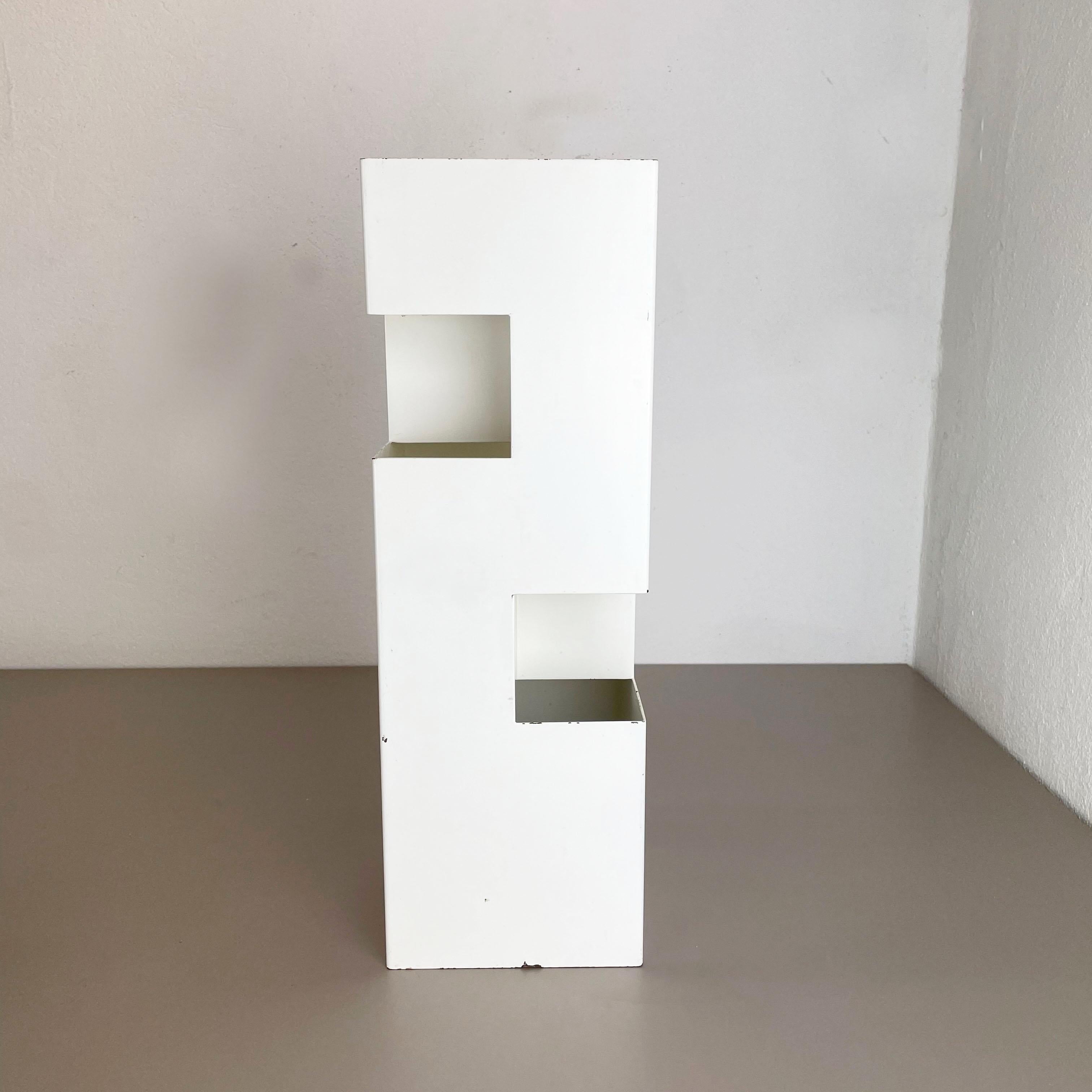 Article:

Modernist umbrella stand


Origin:

France


Decade:

1970s




this original vintage modernist umbrella stand was produced in the 1970s in France. it is made of solid metal with a CUBIC form the design and style in