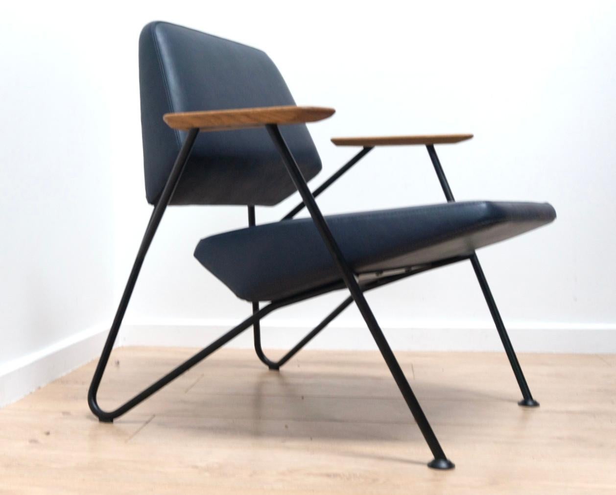 Original Modernist Polygon Easy Chair Designed for high quality contemporary modern furniture manufacturers Prostoria. Minimalist design with quality craftsmanship throughout. The chair features light oak paddle armrests, original black steel finish