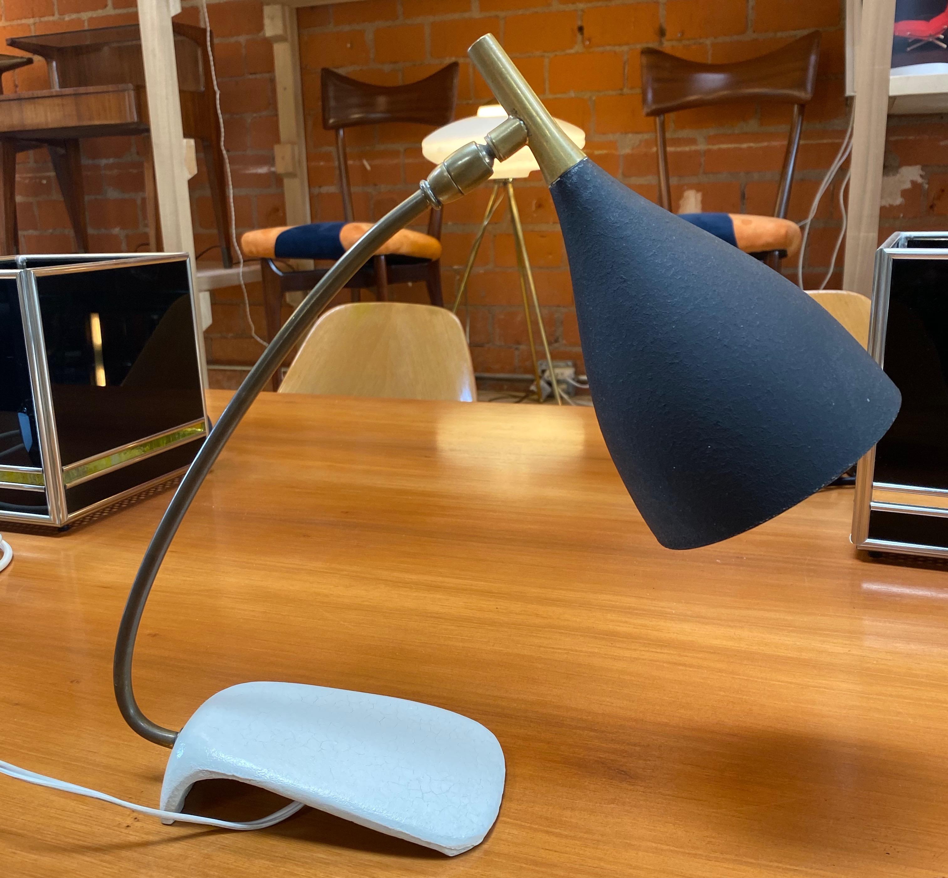 This original 1970s table light made by Cosack in Germany. This Minimalist table light has a white base and black lacquer tone finished lovely formed shade. The light features one socket for bulbs e 27.
this item remains in a good and full working