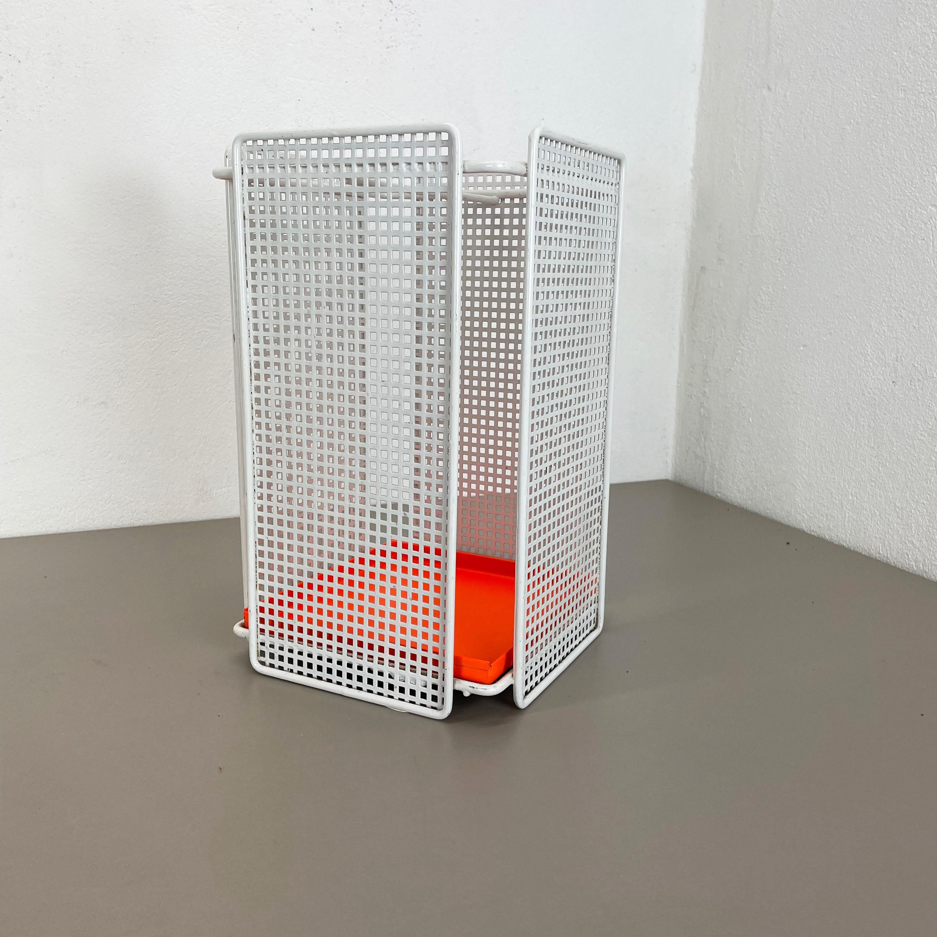 Article:

Modernist umbrella stand


  

this original vintage modernist umbrella stand was produced in the 1970s in France. it is made of solid metal with hole pattern perforation optic and and orange metal dipping shell at the bottom. the design