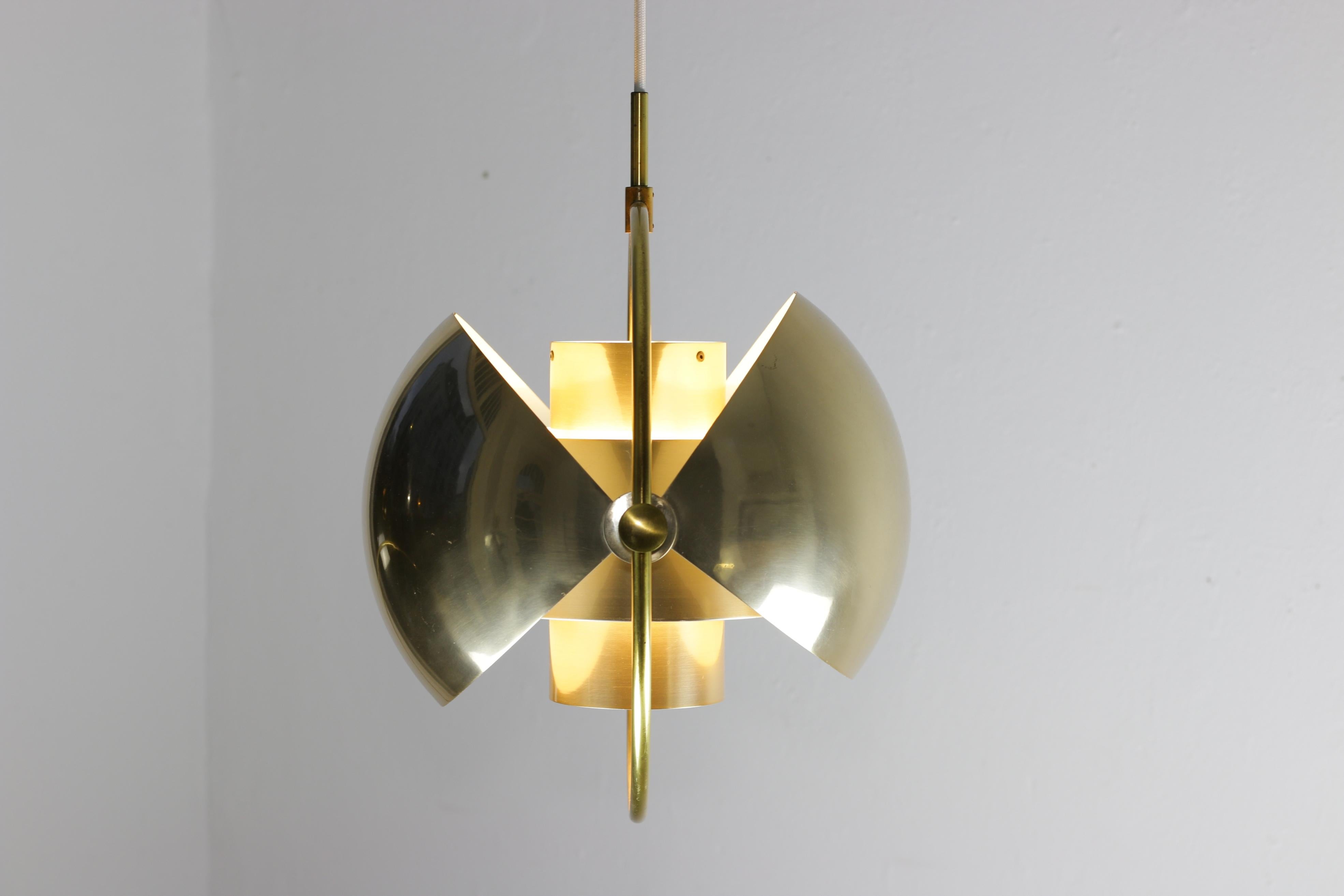 Original vintage Multi- Lite was designed by Louis Weisdorf for the Danish lamp manufacturer Lyfa in 1972.

This lamp has two quarter sphere shaped shades which are moveable in each potential position.
The multi-adjustable halves of the shade