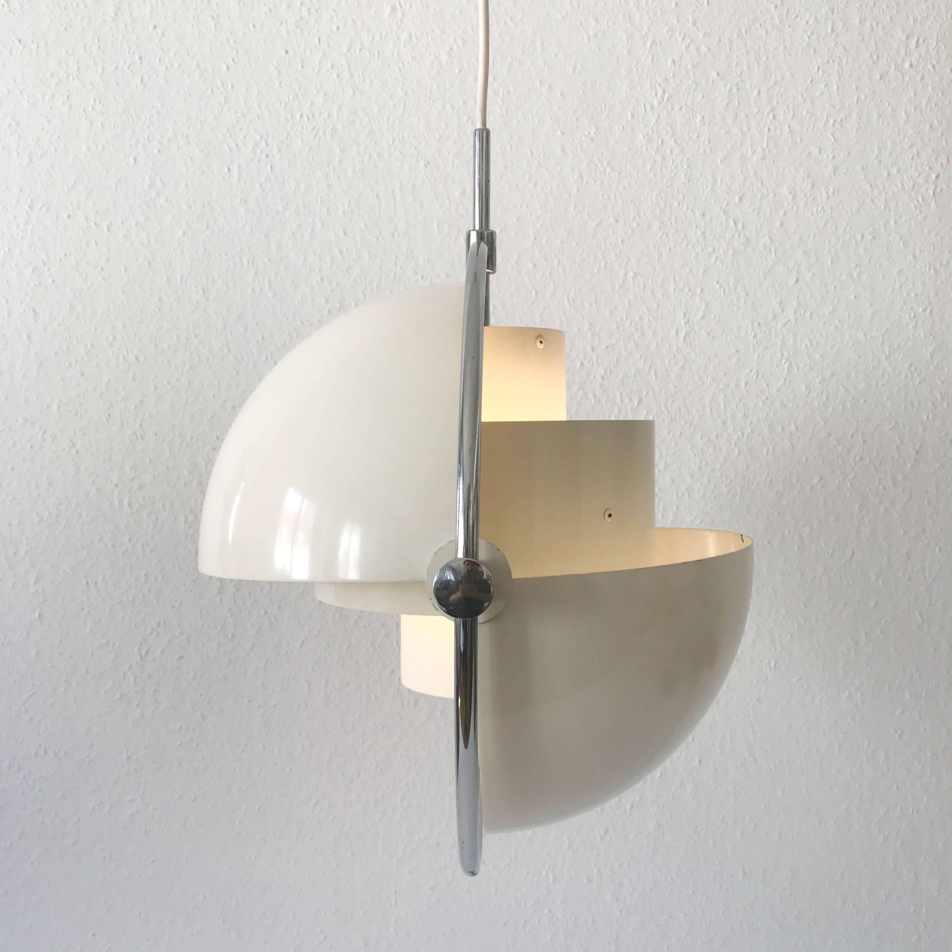 Elegant & original Mid Century Modern 'Multi-Lite' pendant lamp by Louis Weisdorf, 1974. Manufactured by Lyfa, Denmark in 1970s. 
This is a rare white lacquered version. A real light object from Denmark. The lamp shade can be adjusted in various