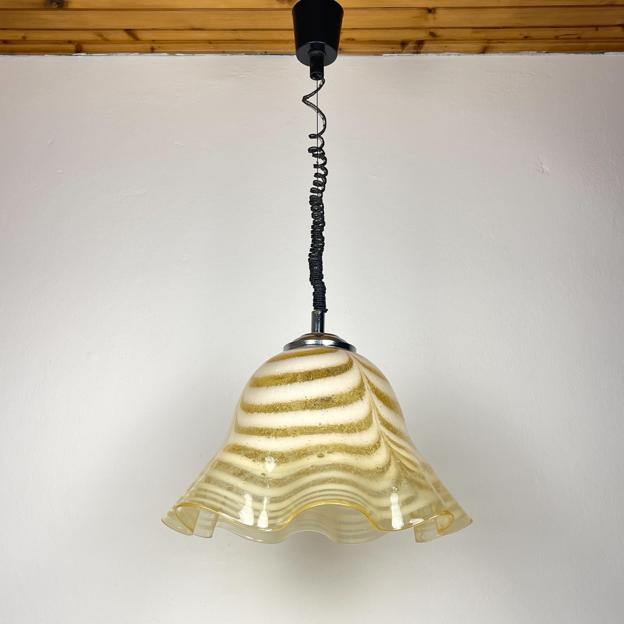The beautiful Murano glass chandelier Fazzoletto made in Italy in the 1970s.
A yellow glass shade with a 