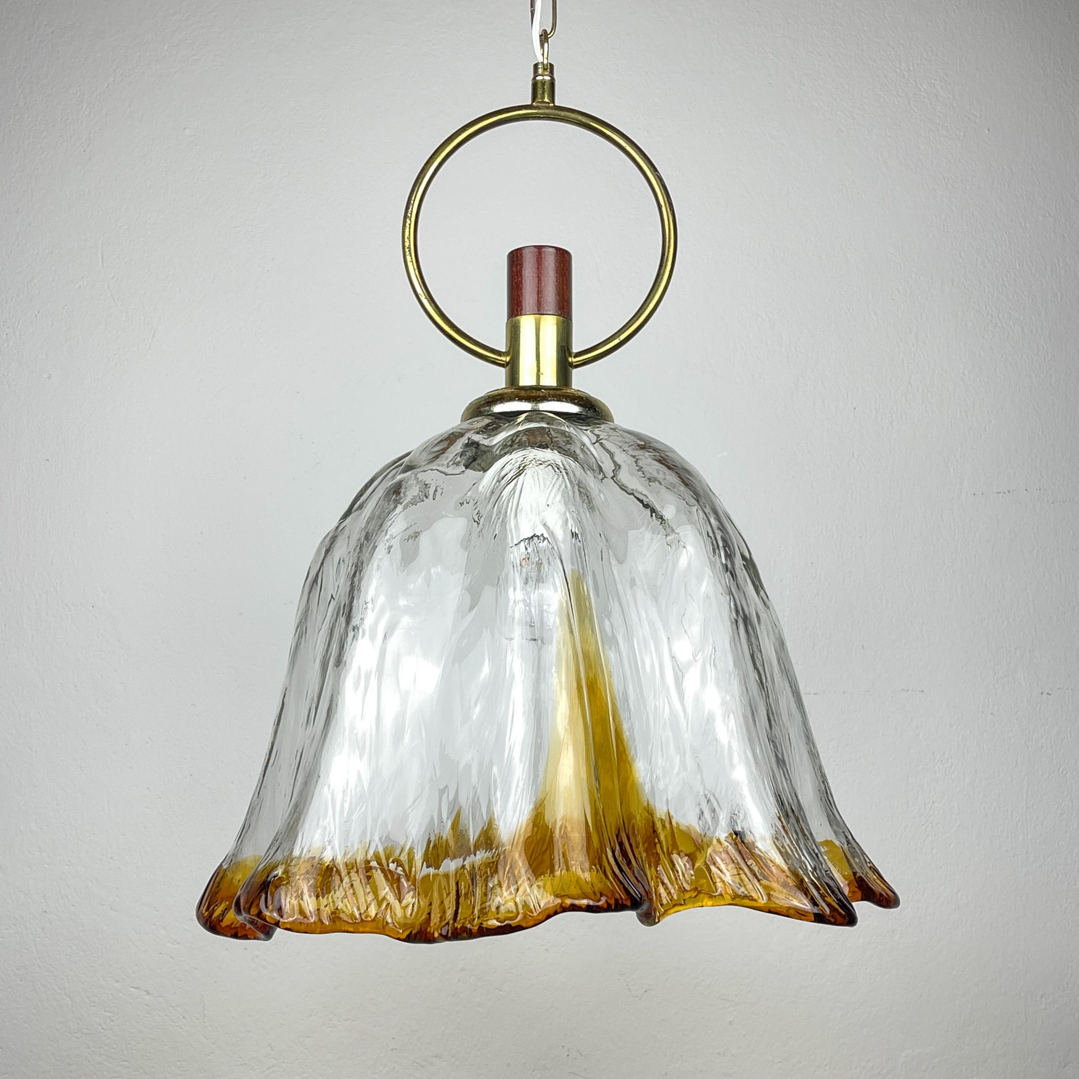 

Original vintage Murano pendant lamp made in Italy in the 1970s.

Good vintage condition. No chips or cracks. Wiring replaced by a professional electrician.

Dimensions:
Width: 40 cm / 15.74 inches
Height: 52 cm / 20.5 inches
Lamp height with
