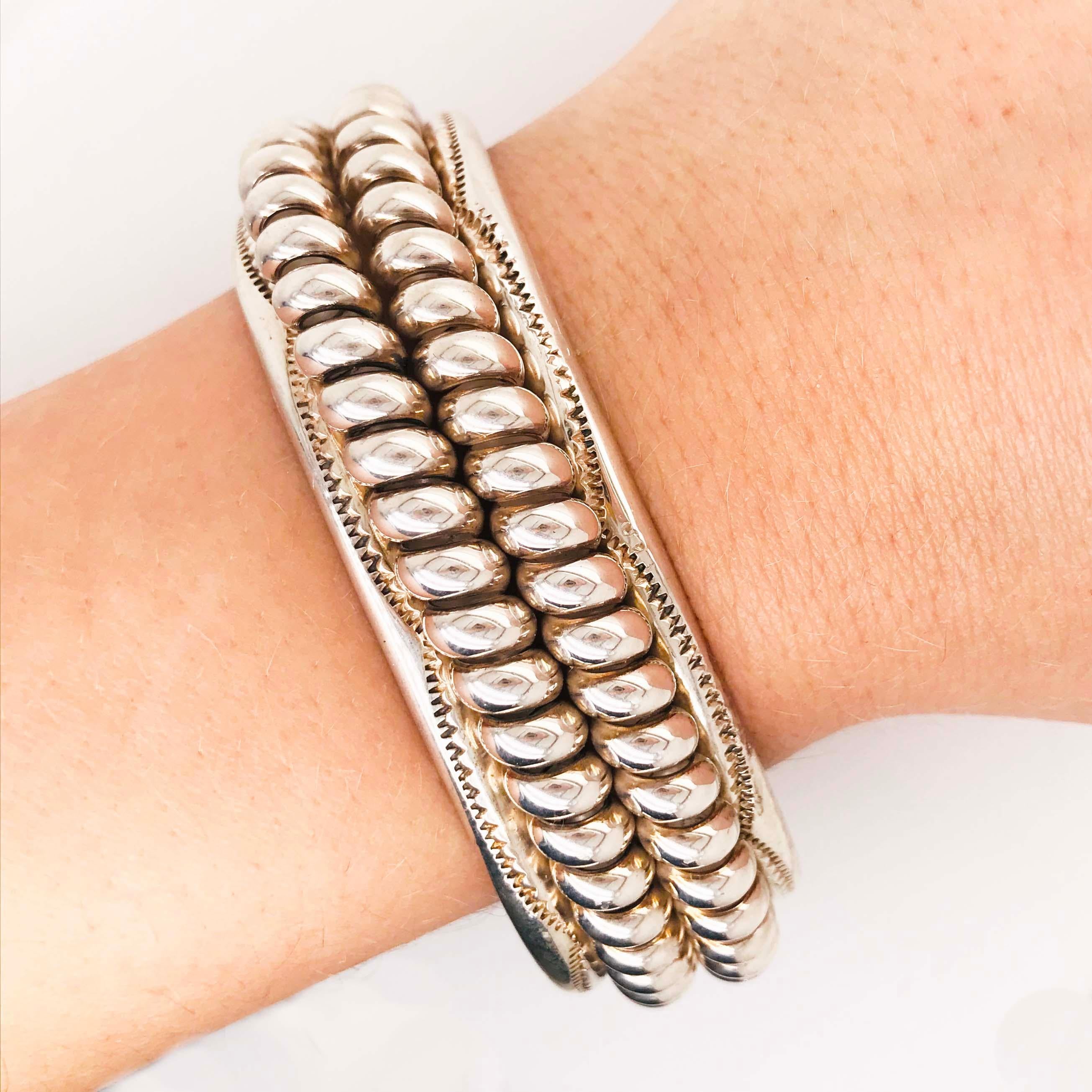 This original Tahe sterling silver Native Navajo cuff bracelet is bold and beautiful! The Caviar like design is a big fashion statement in fine jewelry. This original design is an intricate sterling silver, handmade fine jewelry piece. 
This fine