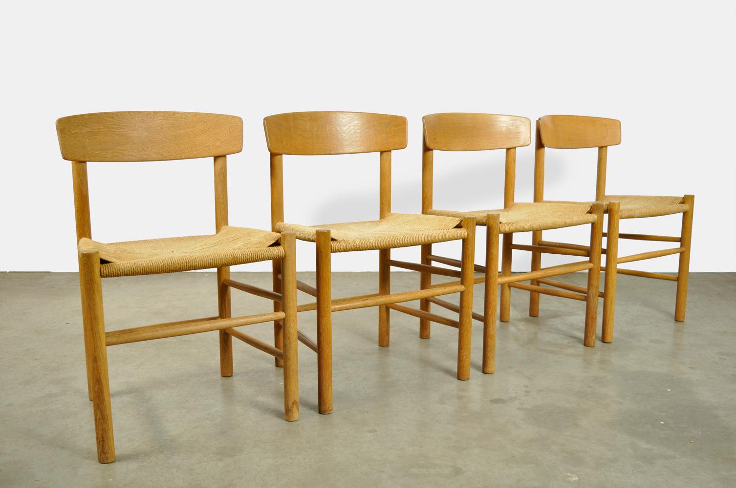 set of four early editions oak dining table chairs, model J39, designed by Borge Mogensen and produced by F.D.B. in Denmark 1960s. “The peoples chair” has a beautiful oak frame and papercord (rope) seats. The chairs are original and marked.